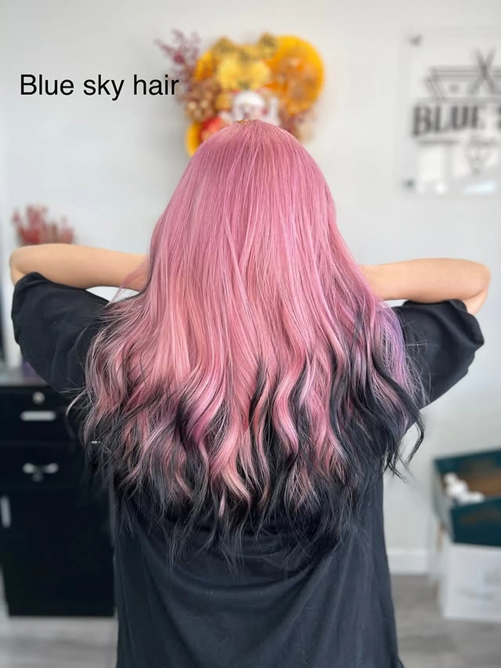 Long wavy hair with a pink to black ombre color melt. 1