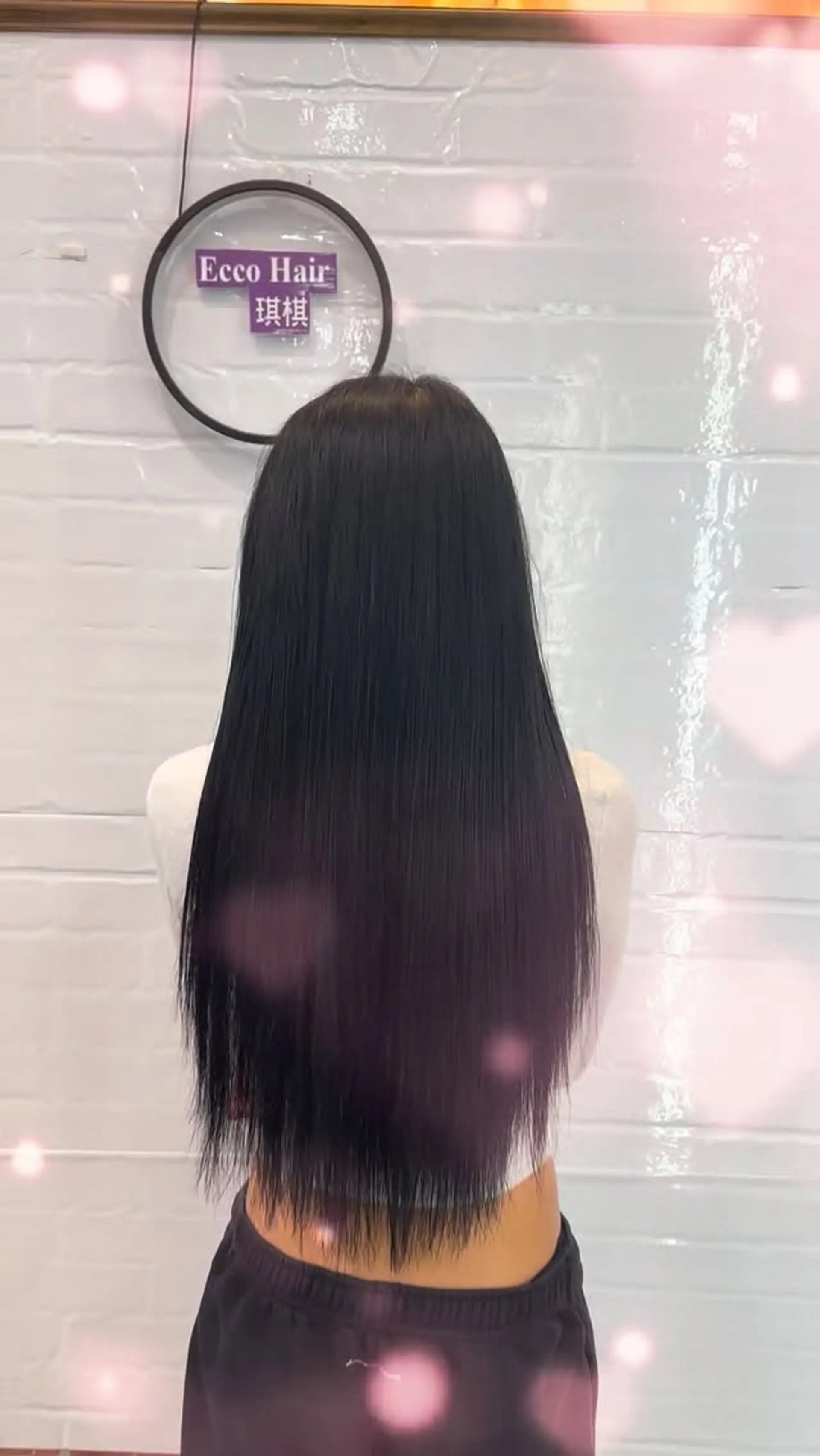 Ultra-long, pin-straight black hair with finely textured, feathered ends. 1