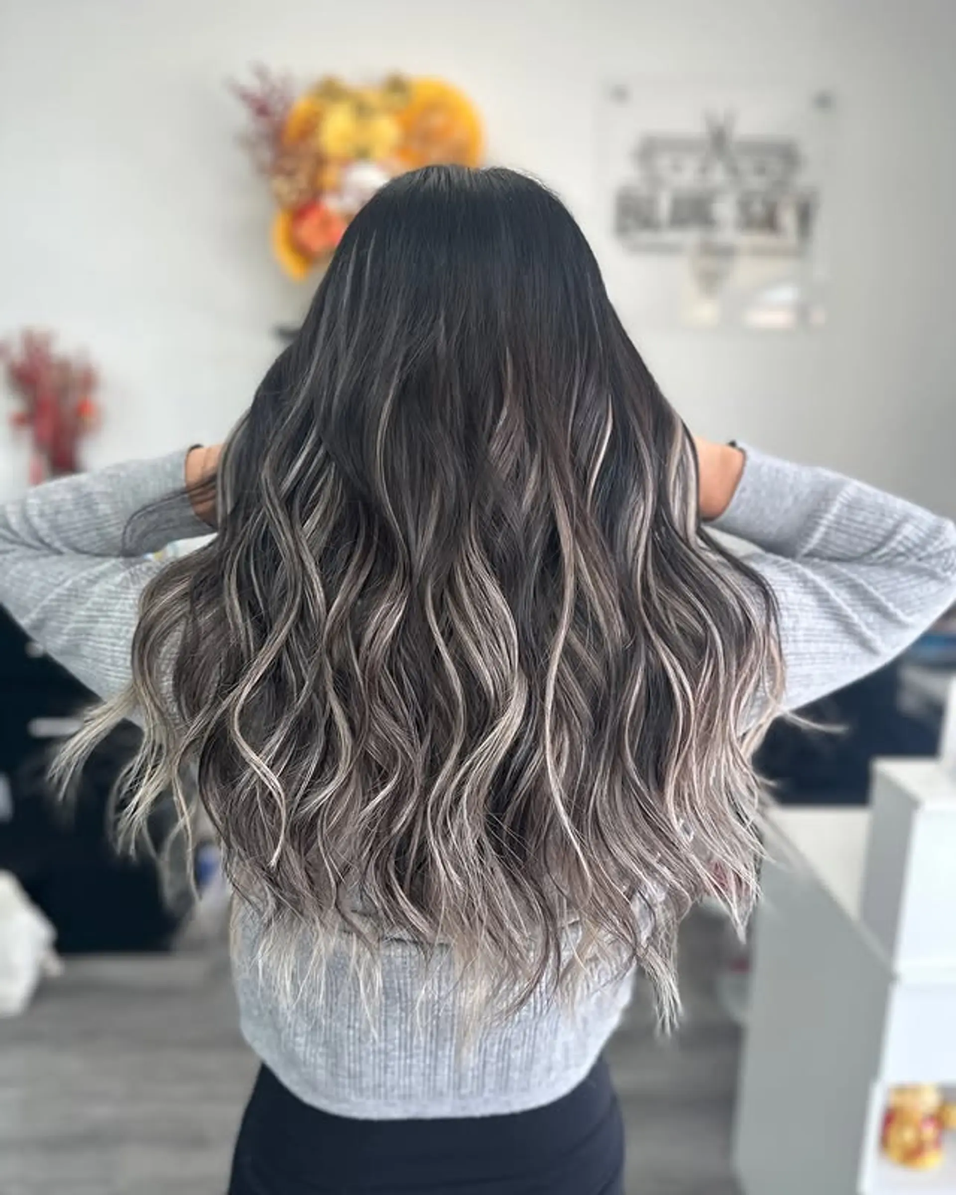 Long, wavy hair with ash blonde balayage. 1