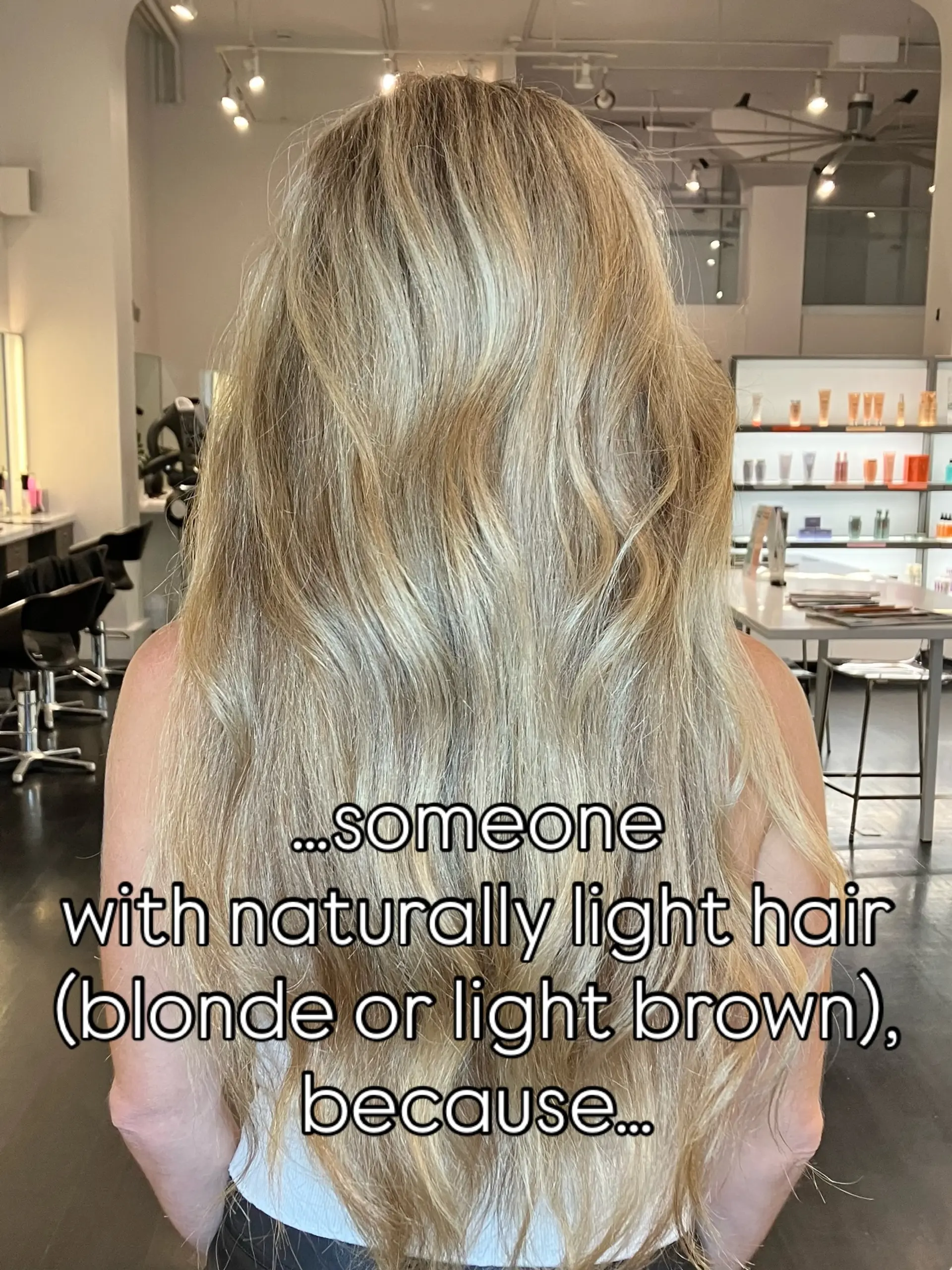 Long, flowing blonde hair styled in soft natural waves with seamless multidimensional highlights. 1