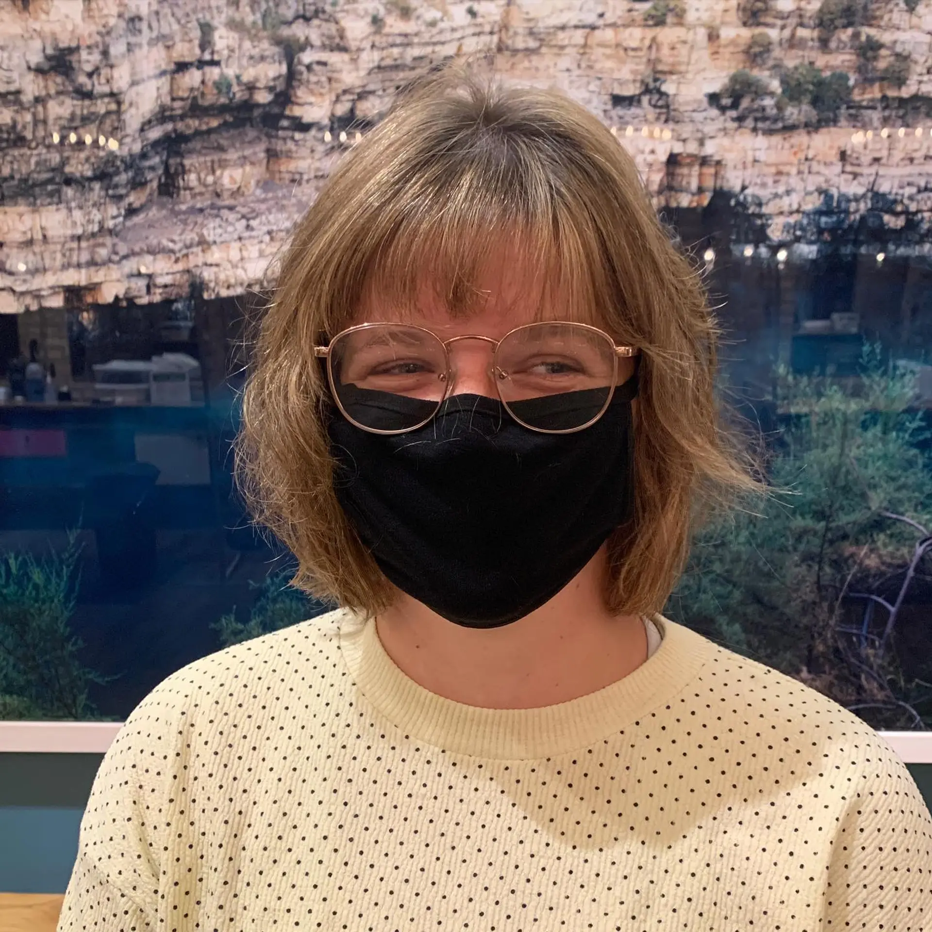 A trendy medium-length, layered bob with baby bangs and a textured finish. 2