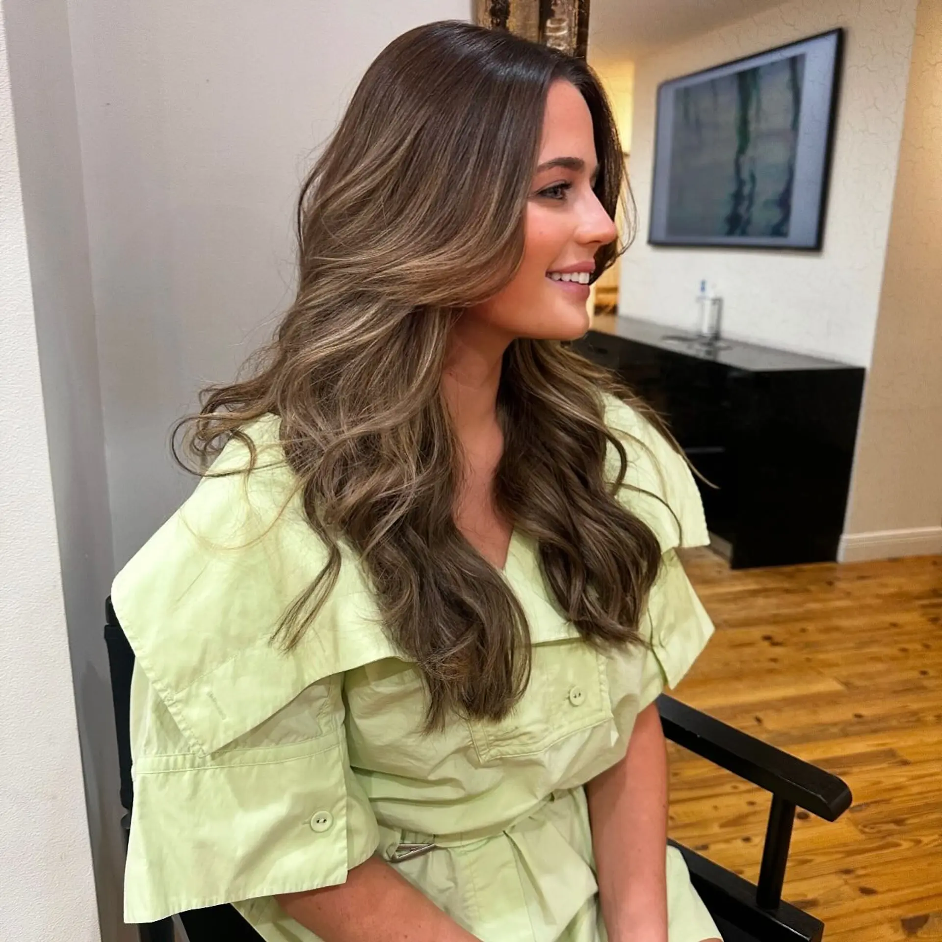 A gorgeous long wavy hairstyle with a bronde balayage, expertly blended for a seamless transition from brunette to blonde. 1