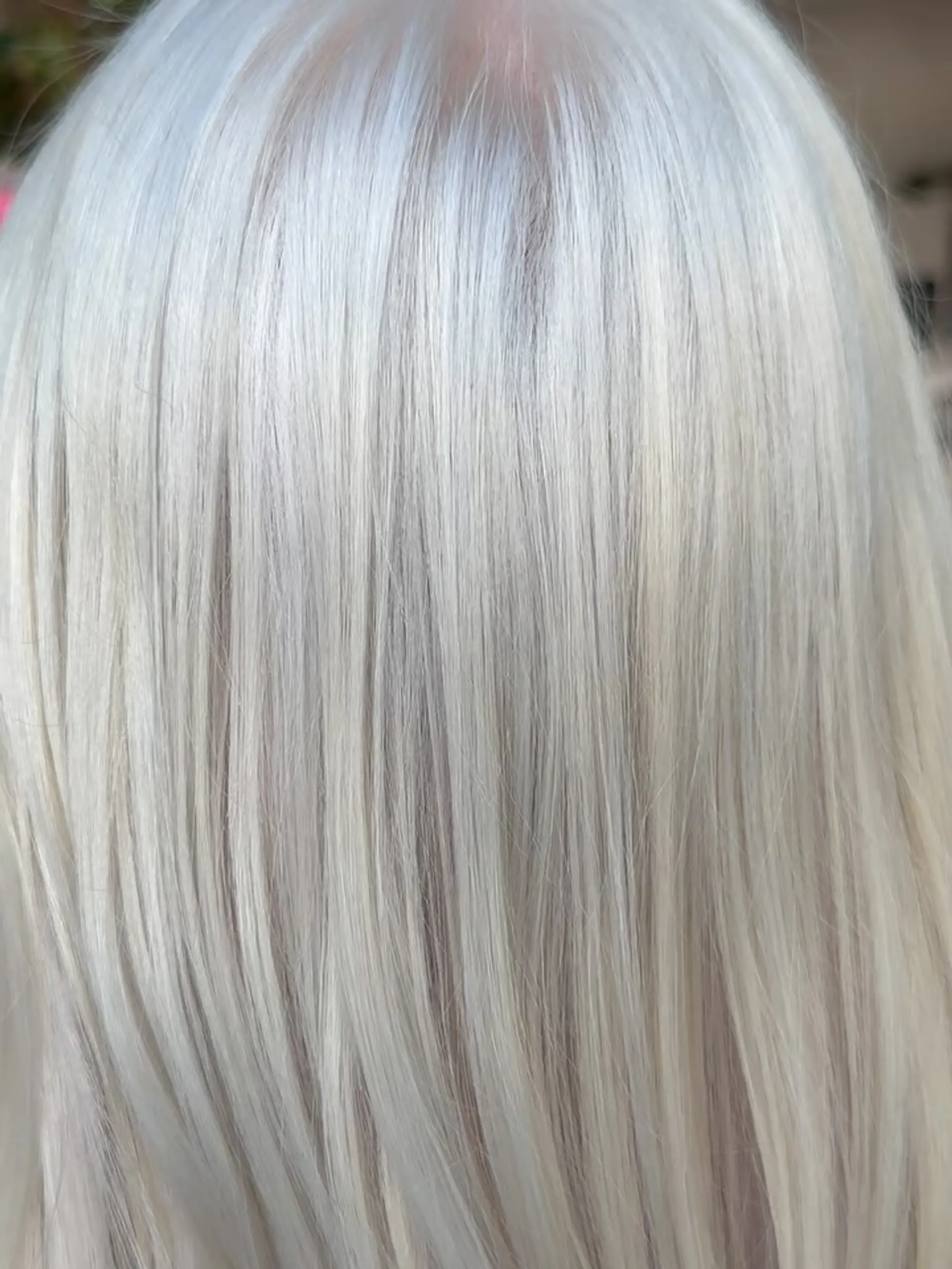 Straight, cool-toned icy platinum blonde hair with a clean, seamless finish. 1