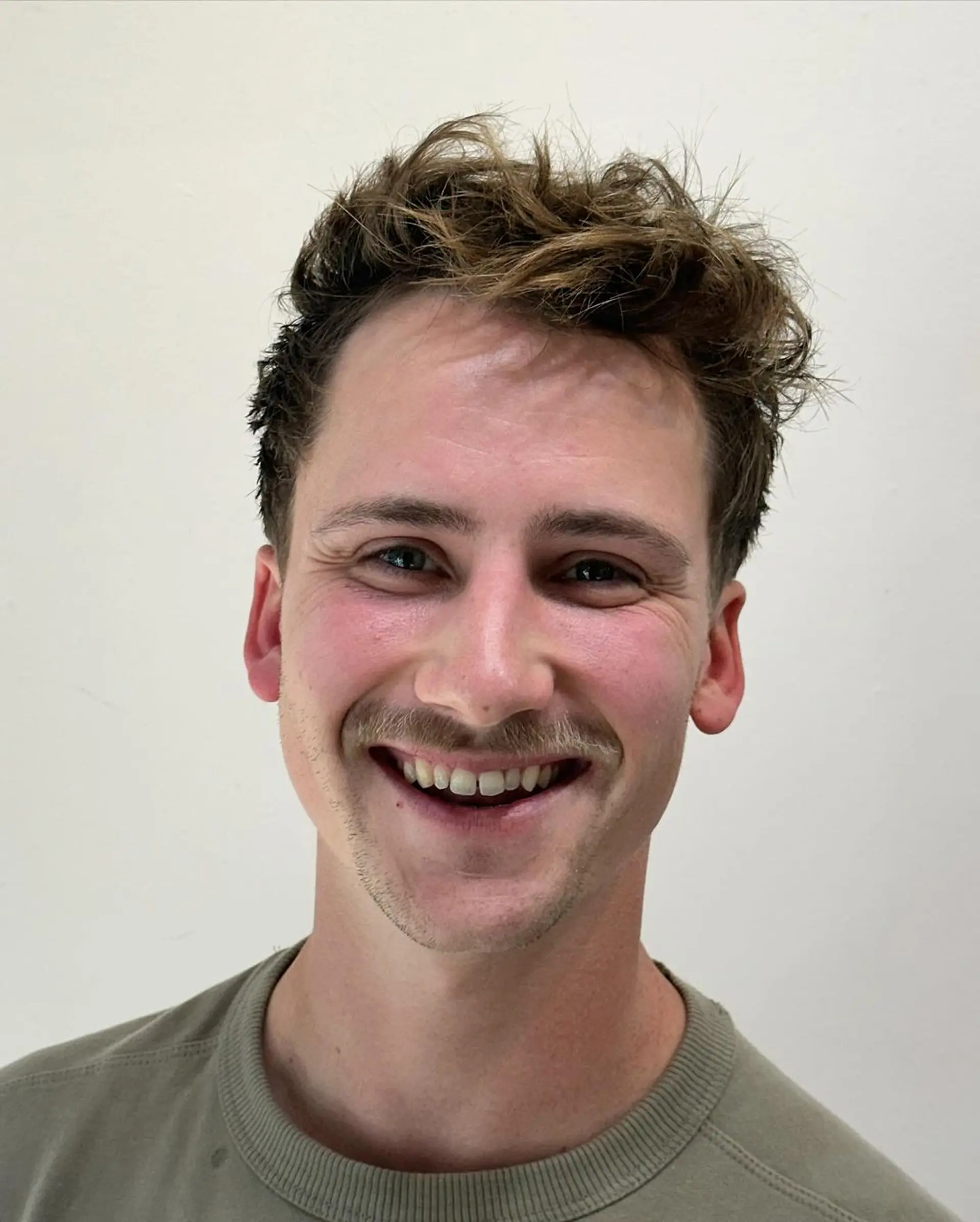 A textured tousle with a natural movement and soft lift on the top, complemented by an undercut side and tapered back. 3