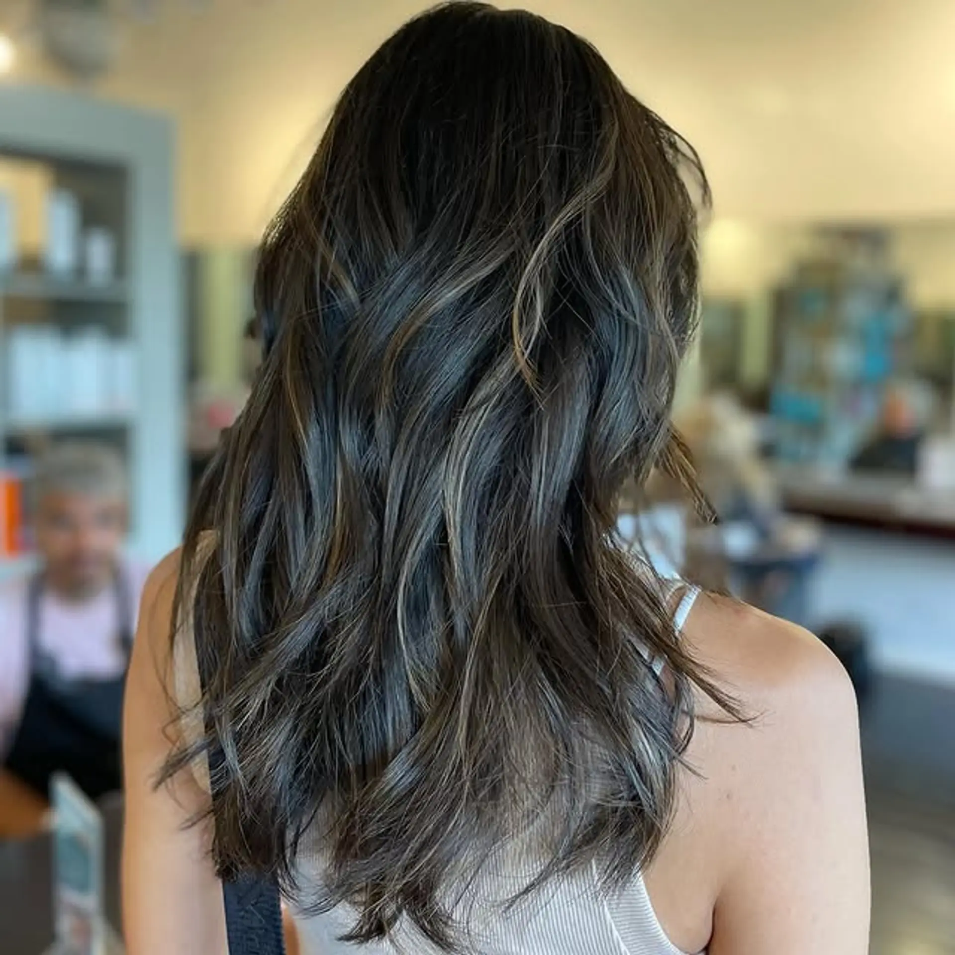 Long, wavy hairstyle with a balayage color melt. 1