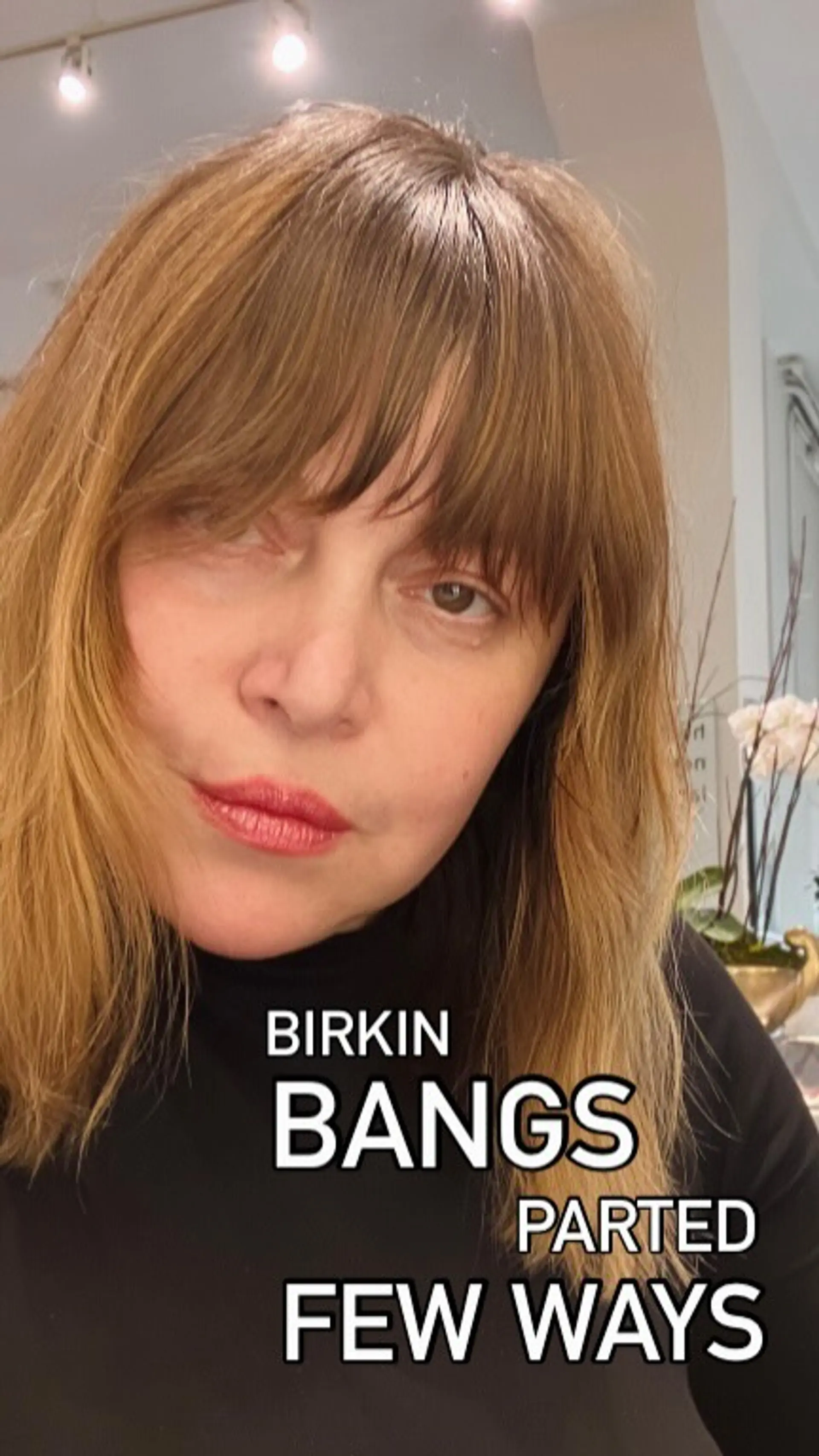 A soft, eyebrow-grazing Birkin fringe with customized texturing paired with shoulder-length warm light brown hair. 1