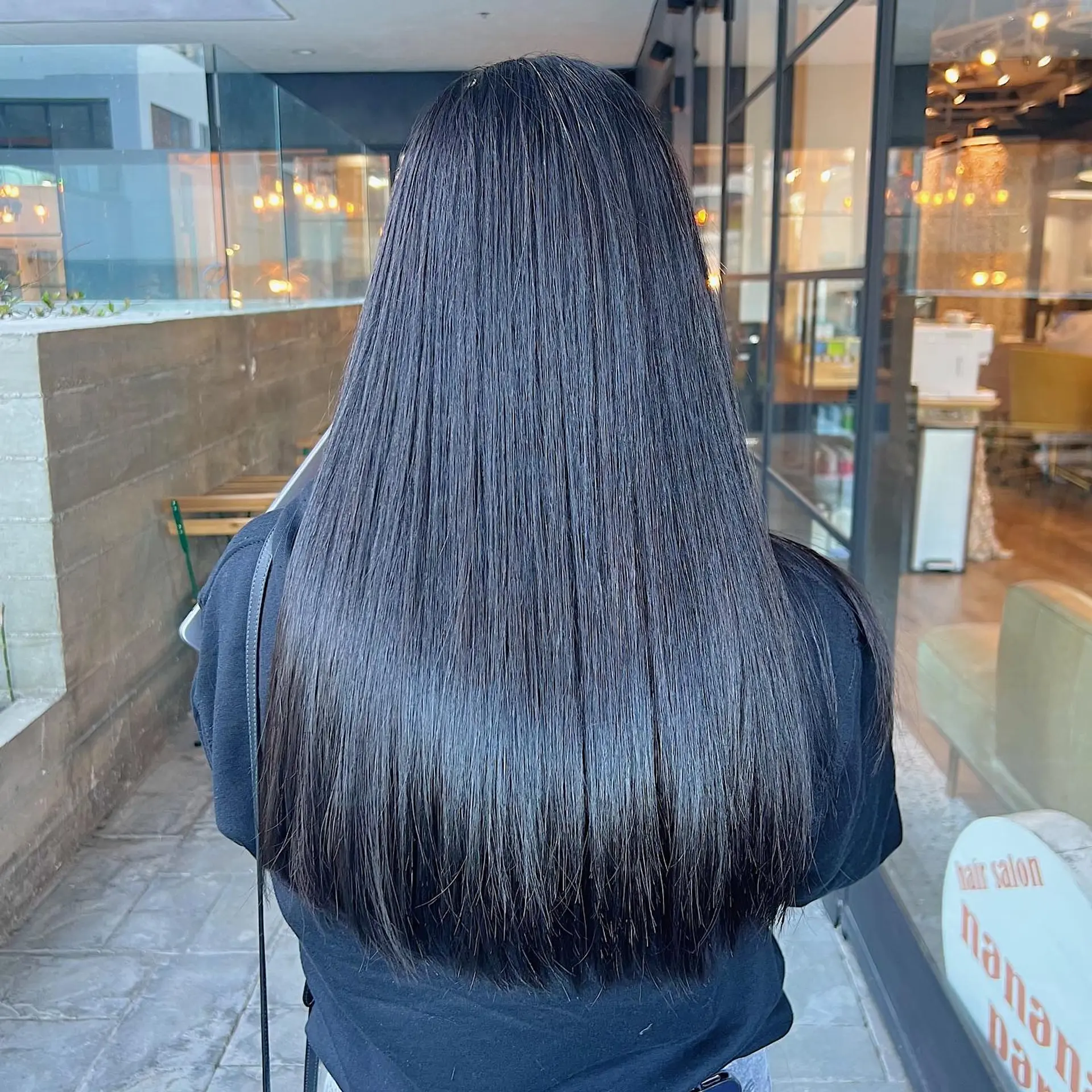 A super sleek, shiny, and straight long hairstyle that gives the appearance of glass. 1