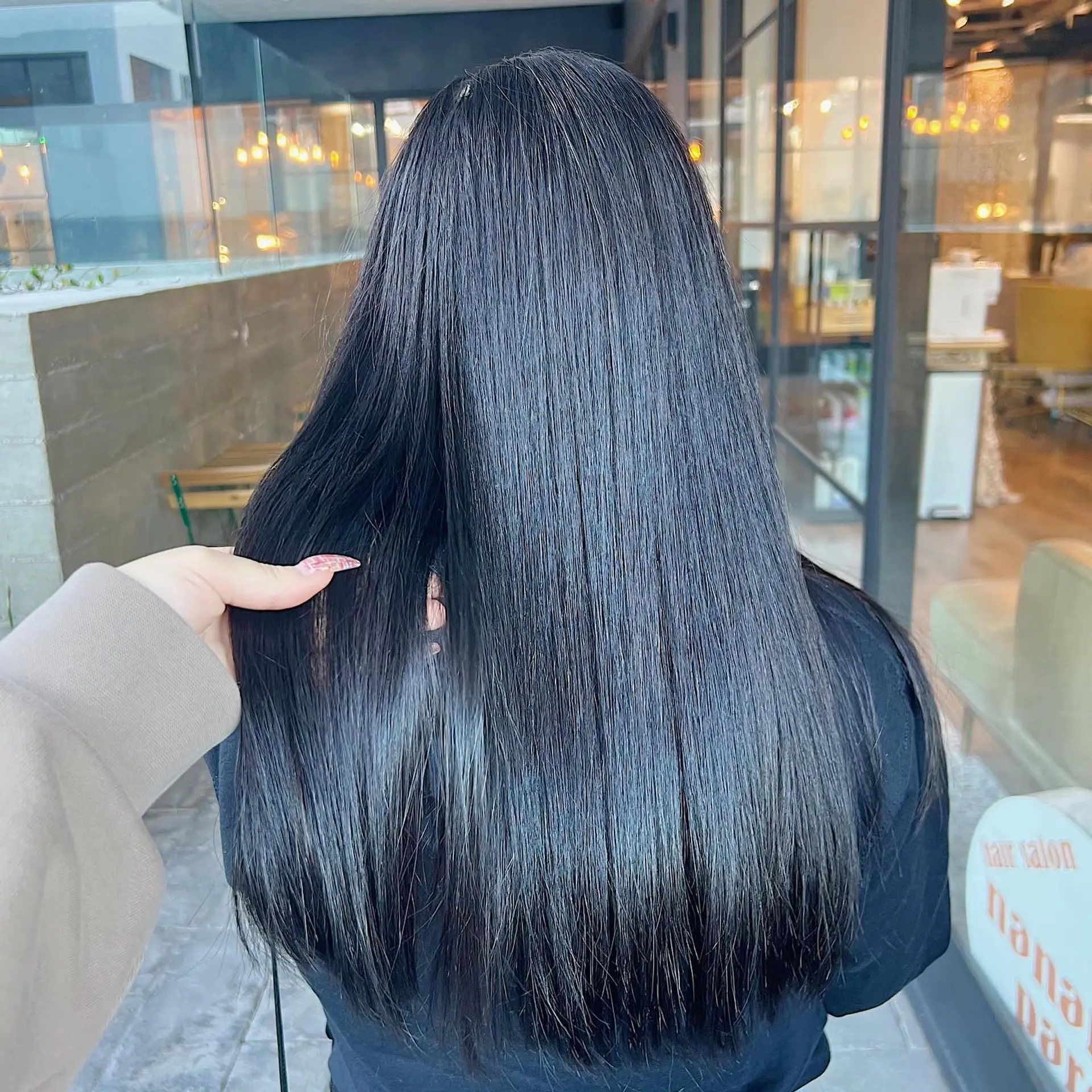 A super sleek, shiny, and straight long hairstyle that gives the appearance of glass. 2