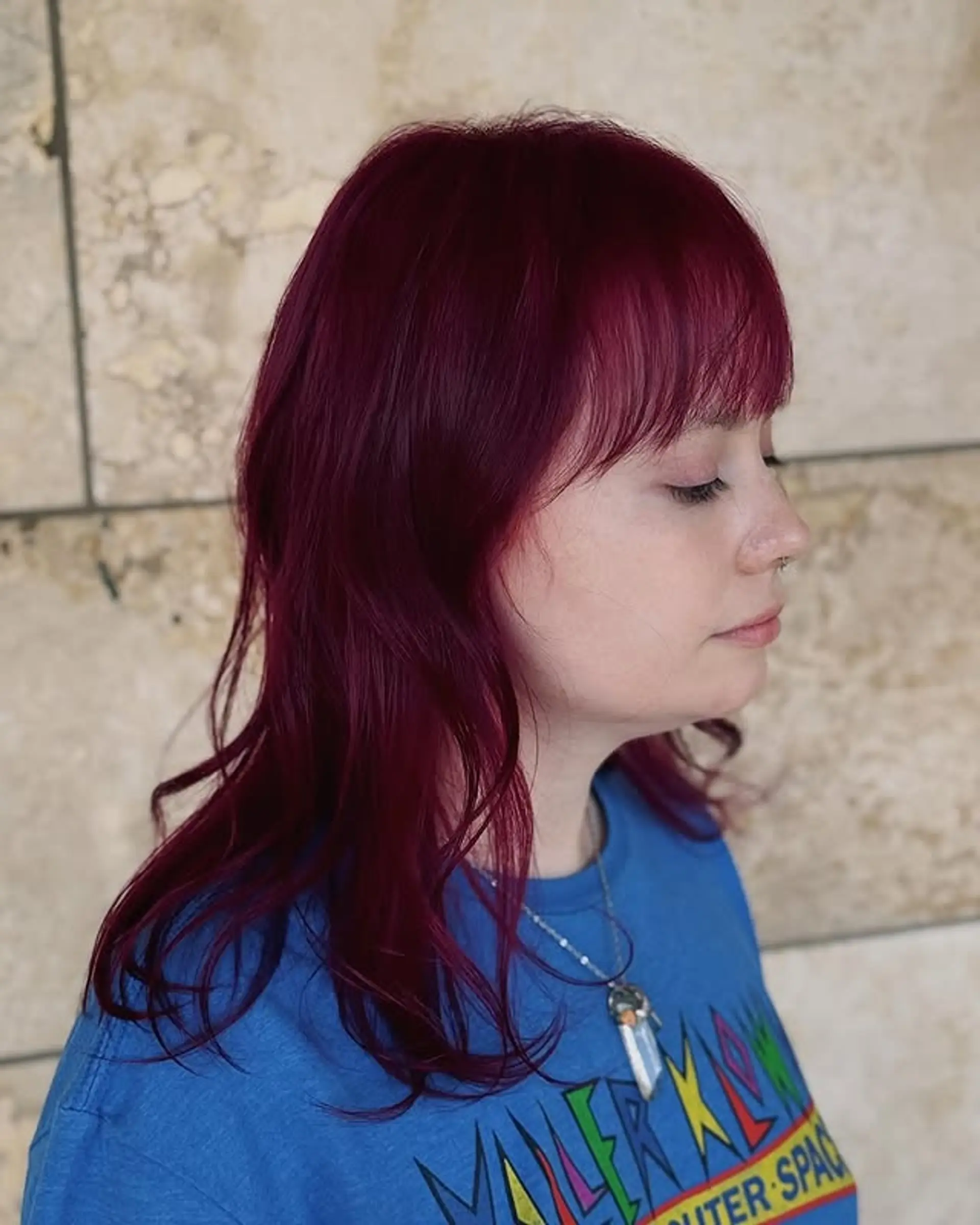 A medium-length shag haircut with bangs. 1