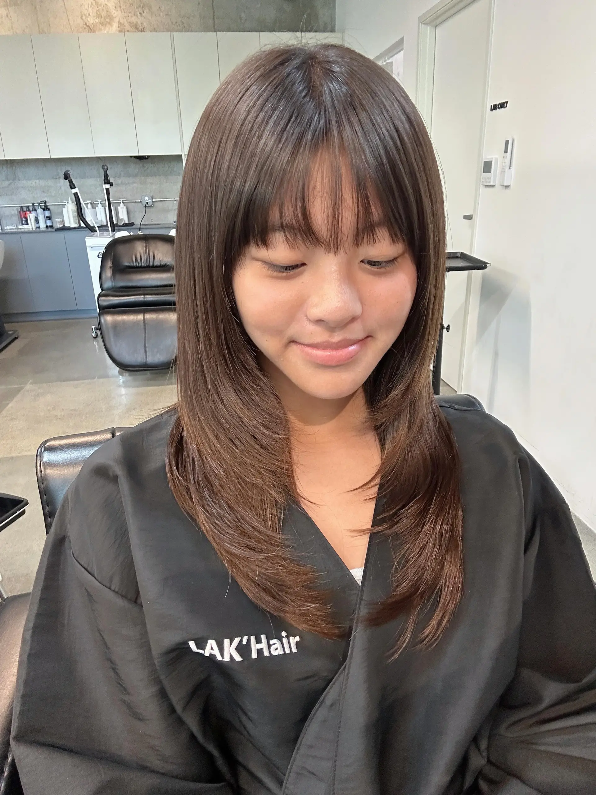 Straight dark brown long hair with soft face-framing layers and a light, wispy fringe. 1