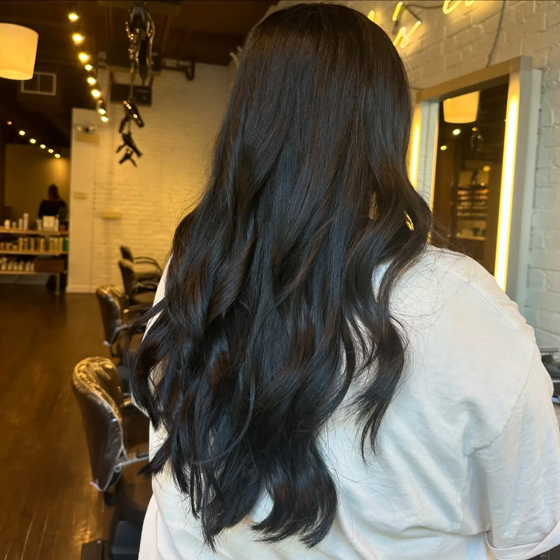 Long, layered hair with soft, loose waves. 1