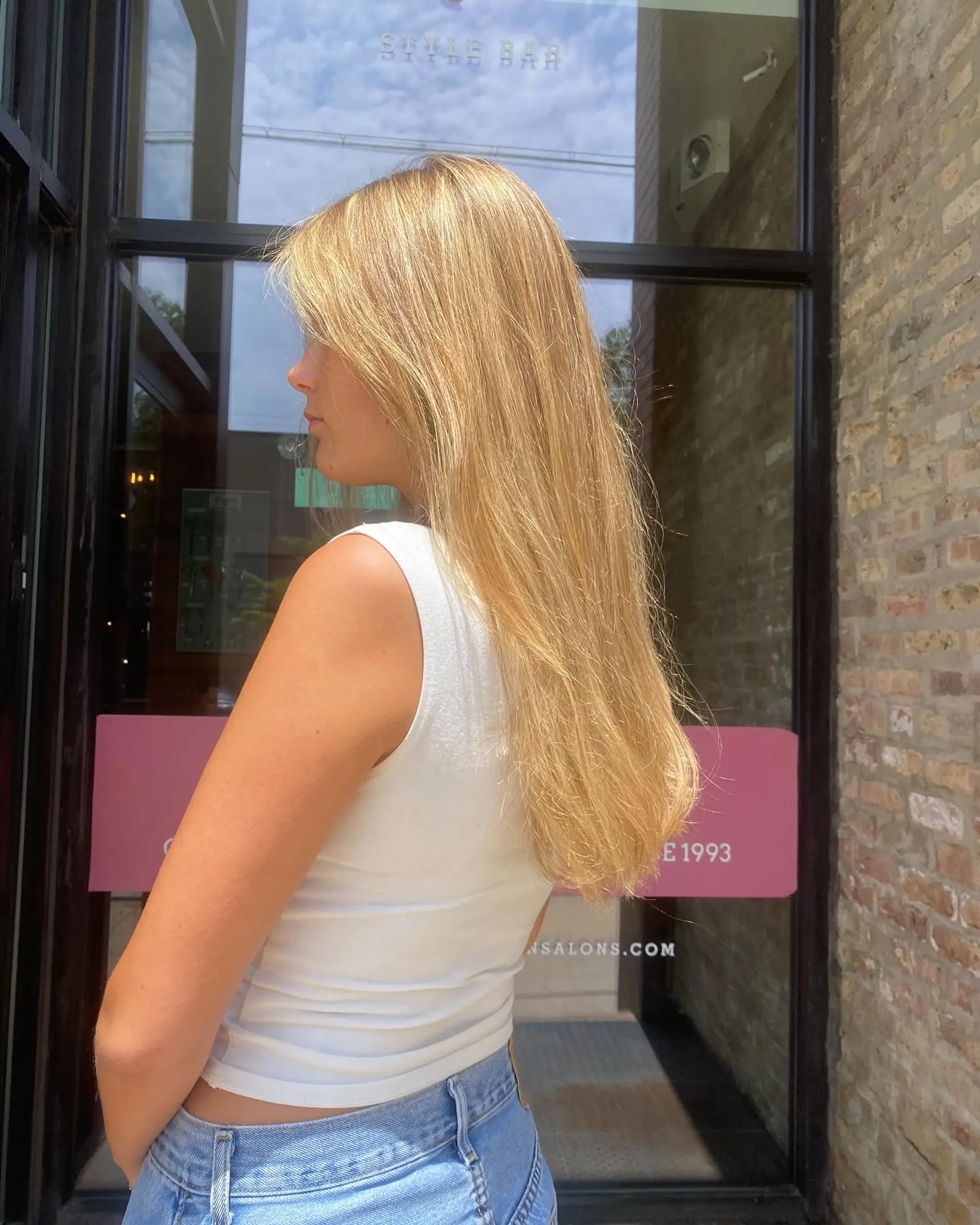 Long, straight blonde hair styled with beachy waves. 1
