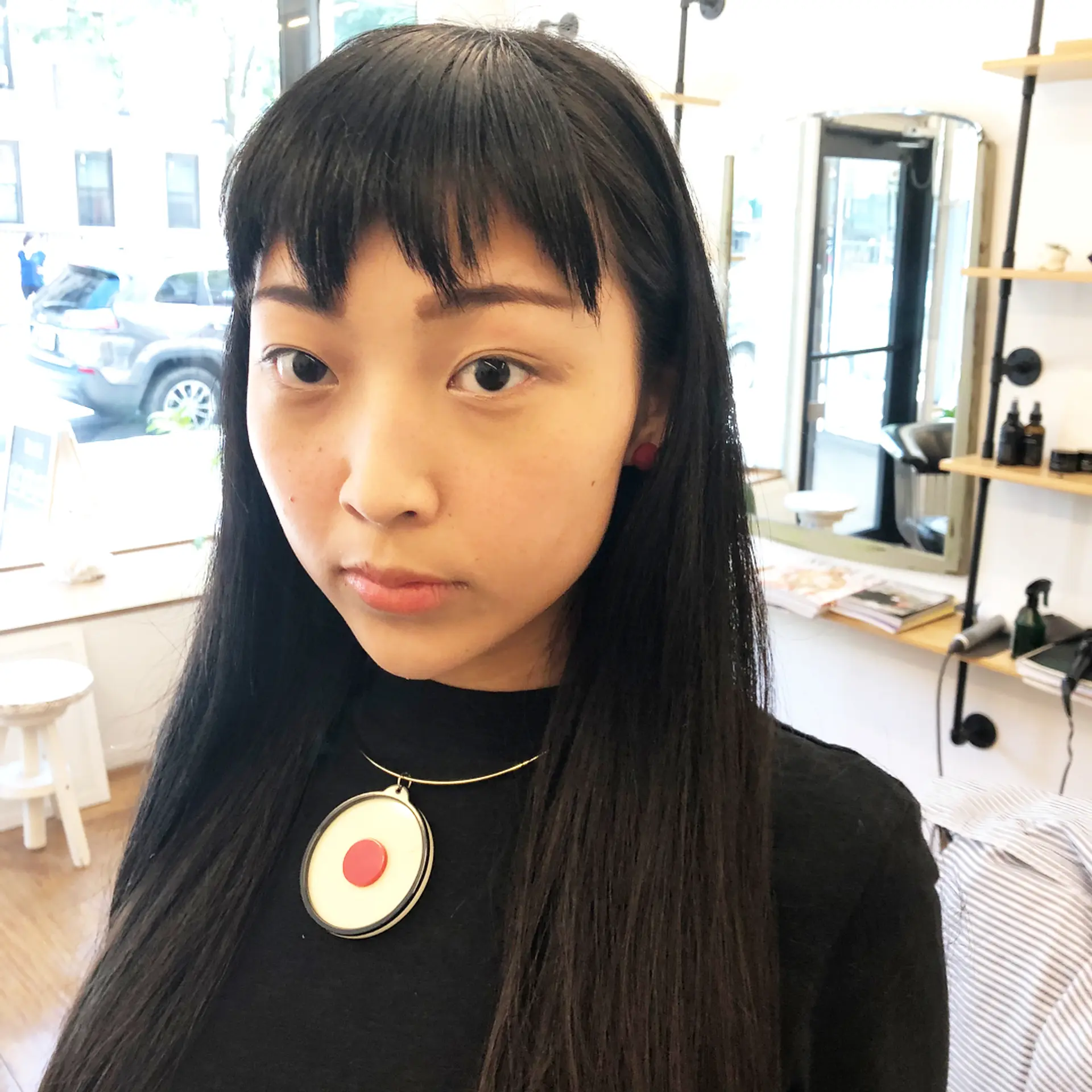 Long, straight, black hair with zig-zagged bangs falling just above the eyebrows, creating a fun look. Inspired by the 1986 Japanese manga, Chibi Maruko-chan. 1