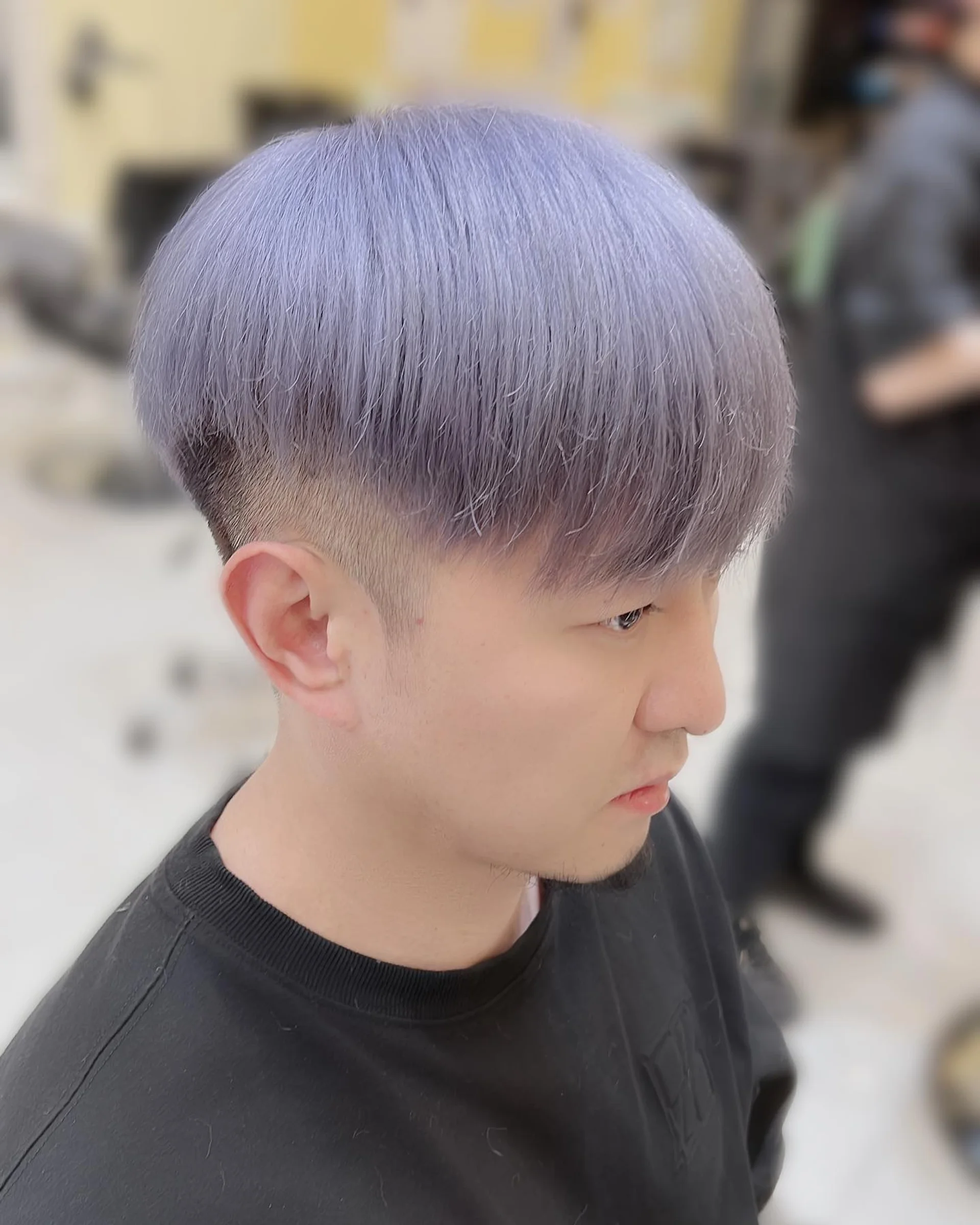 A model with a modern wavy bowl cut, a prime example of the 2026 Beatles-inspired Mod hair trend. - Preview 1