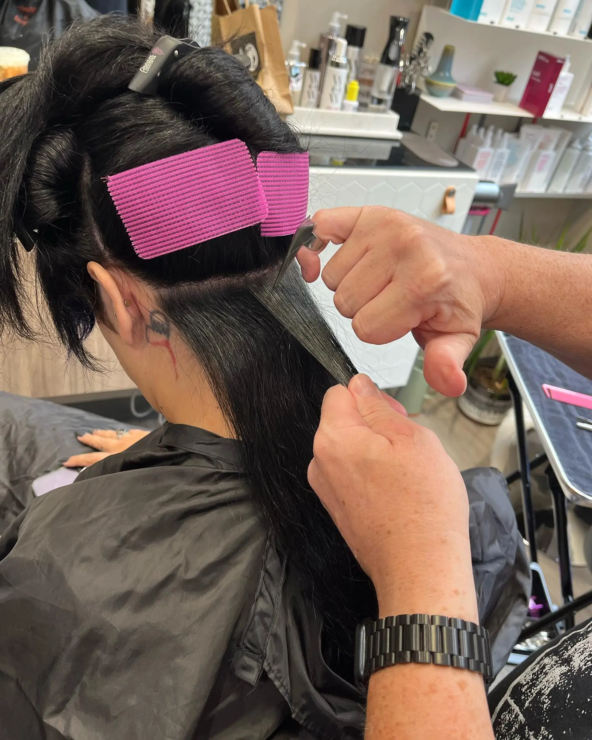 Long straight black hair with blunt electric blue bangs. 4