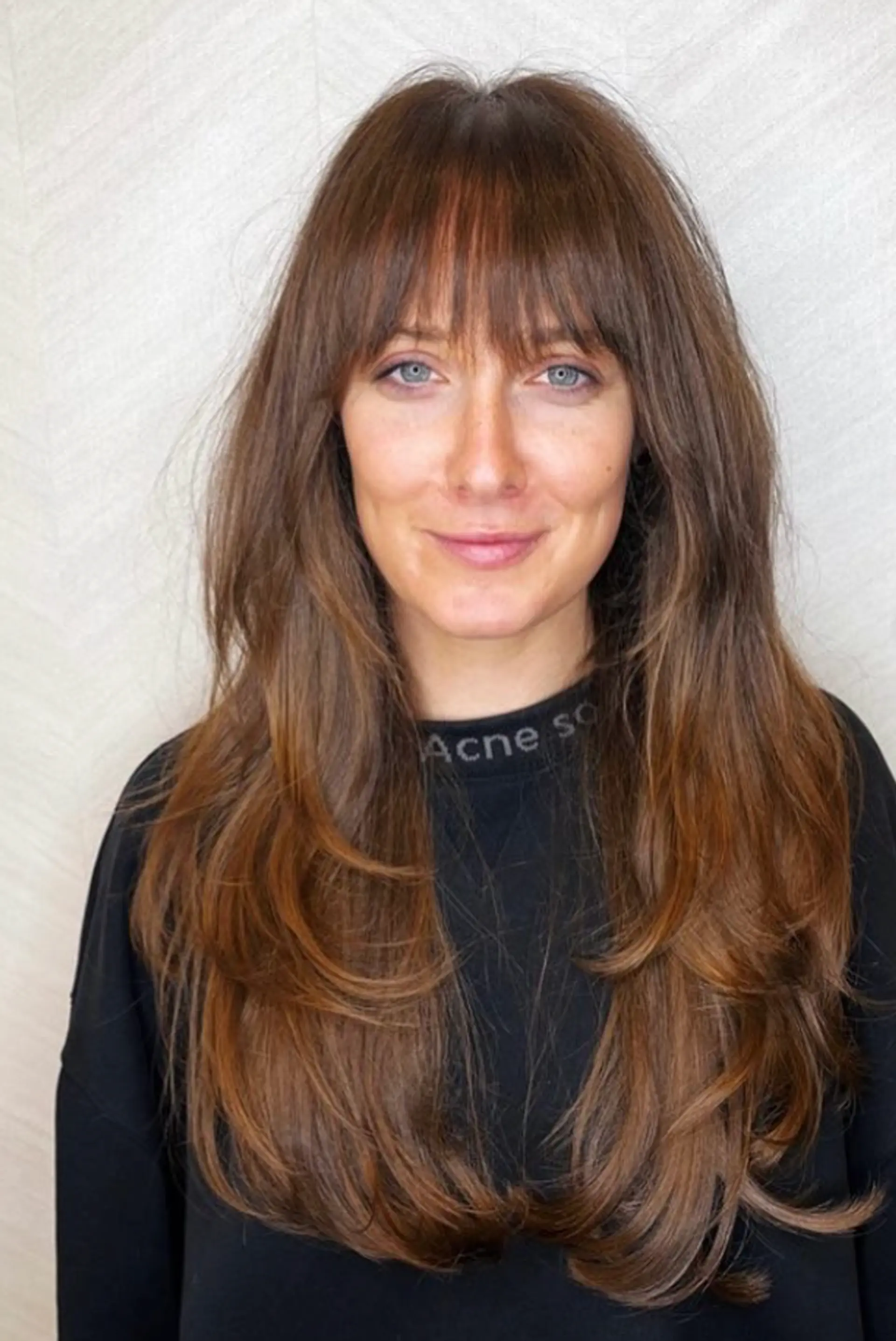 This elegant and very long hair in Chestnut Brown features a blend of natural waves and long, choppy bangs with subtle layering.

Cut and style by @juliamannino_hair 1