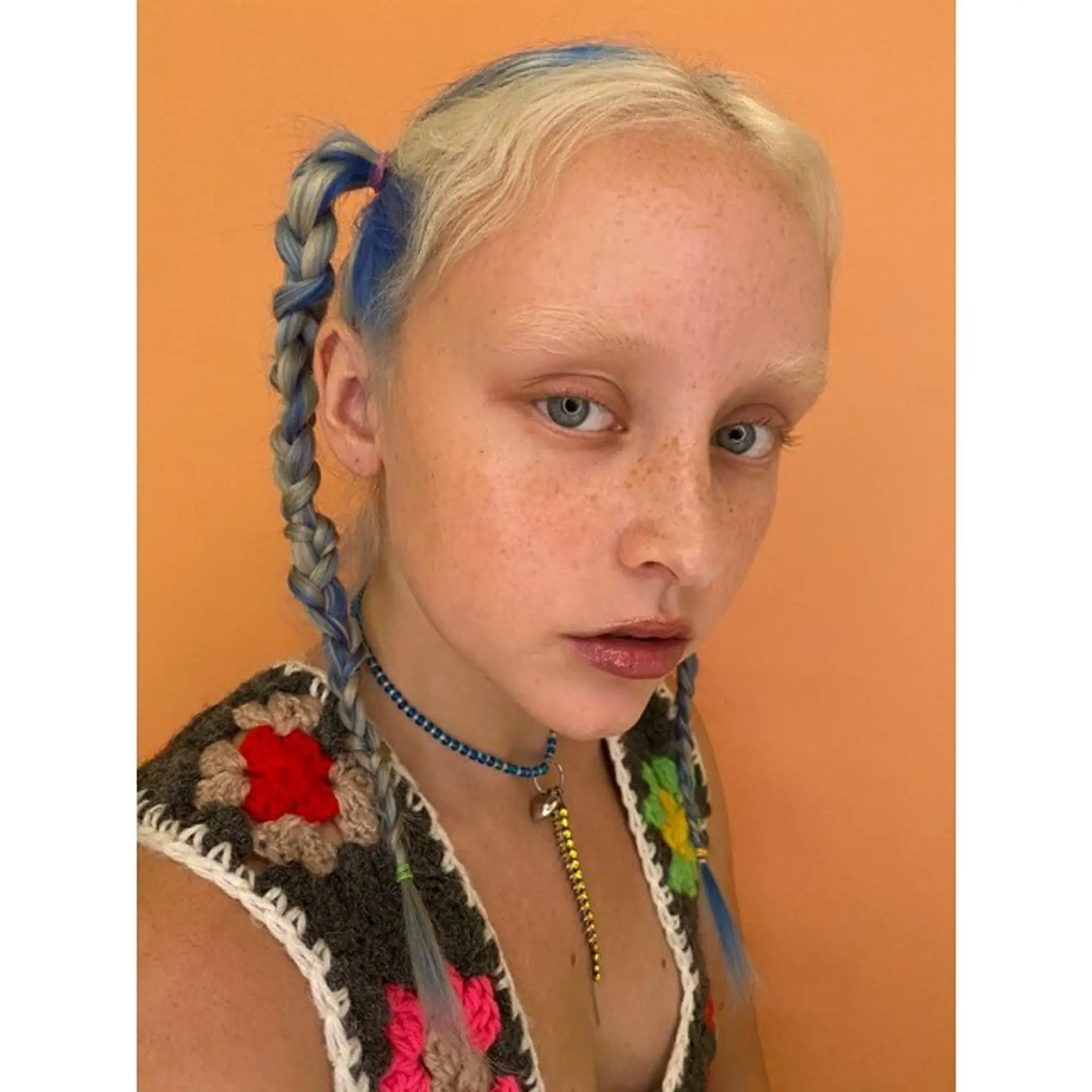 Braided pigtails with pops of blue color 1