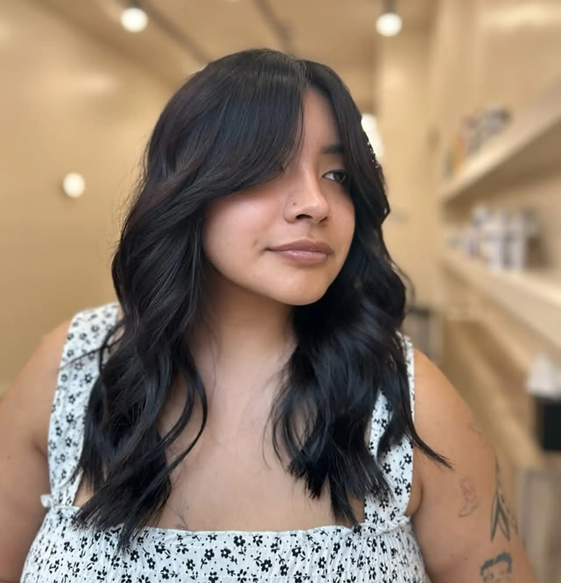 A trendy medium-length shag haircut with face-framing curtain bangs. 1