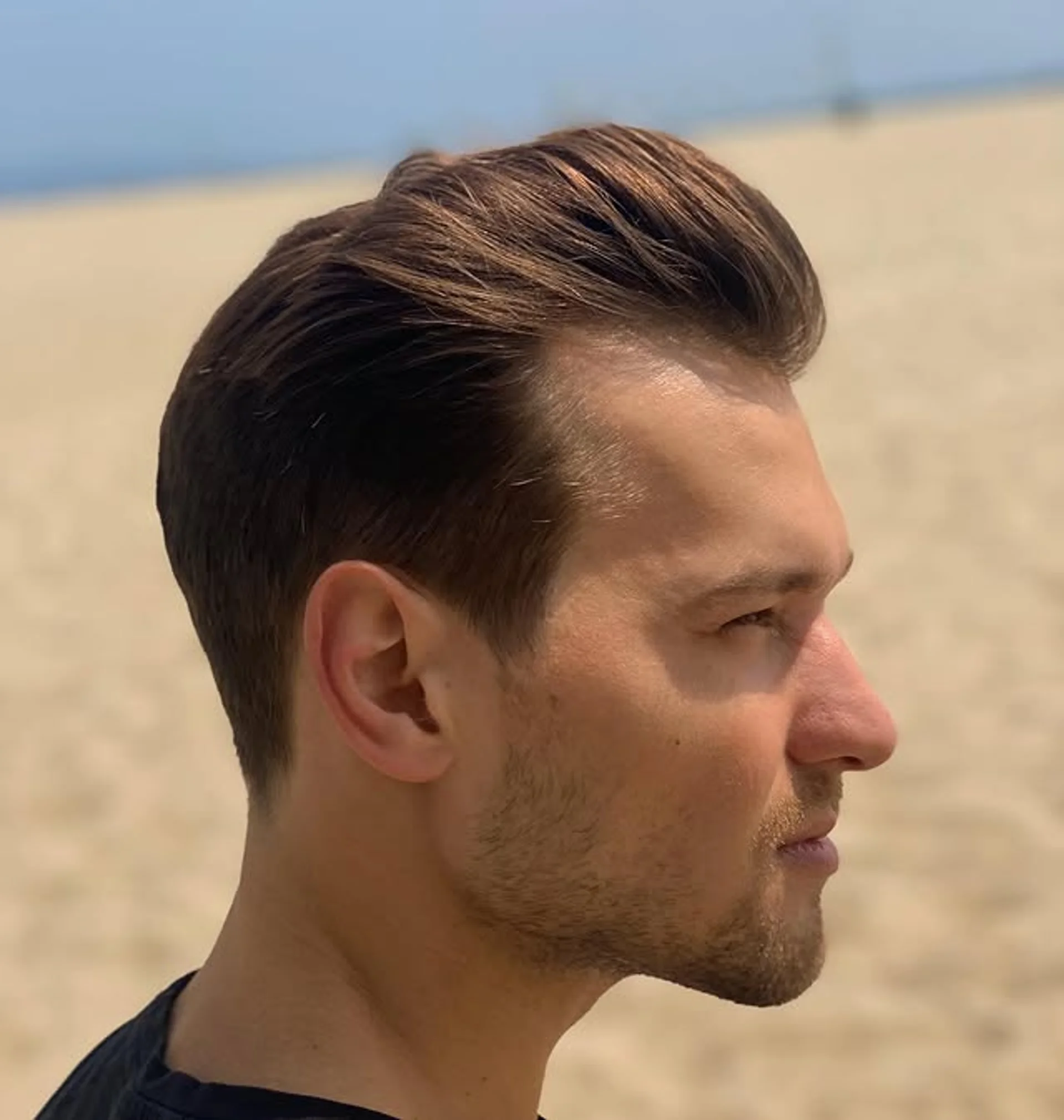 A stylish man sporting a textured pompadour, emphasizing volume and natural hold. - Preview 3