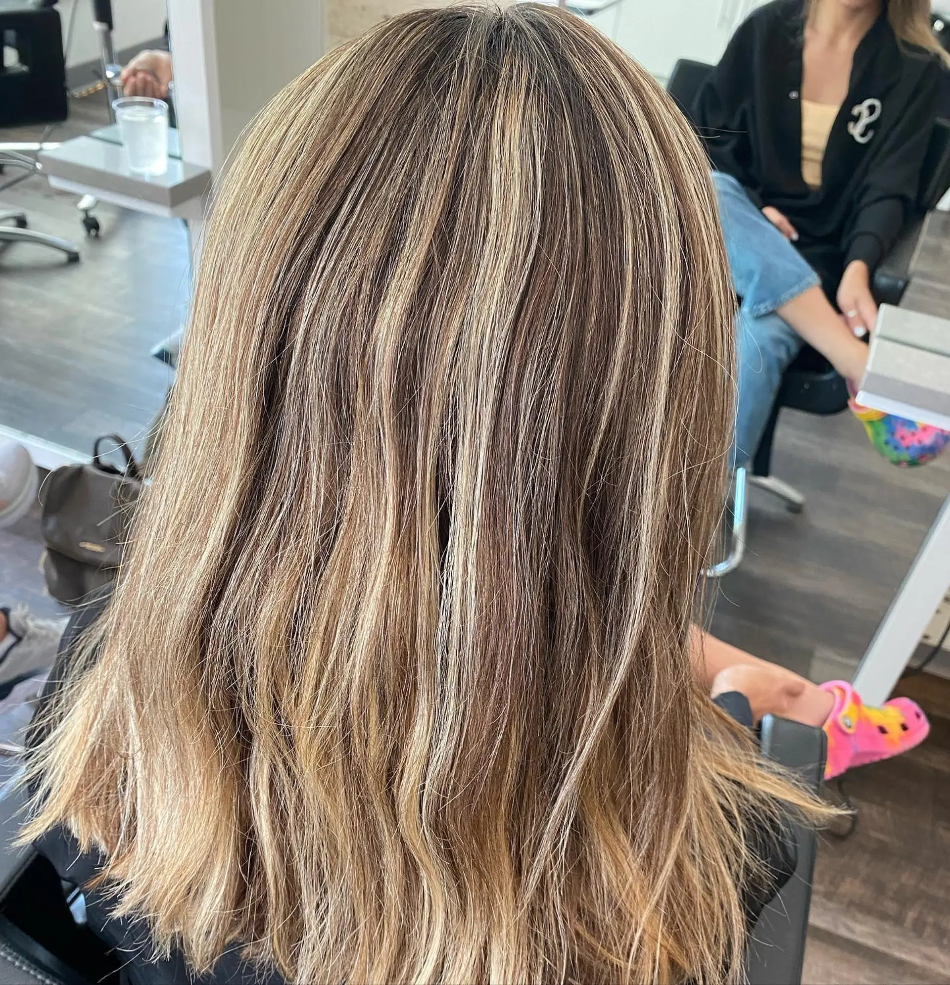 Medium-length dimensional blonde highlights blended with natural light brown lowlights. 1