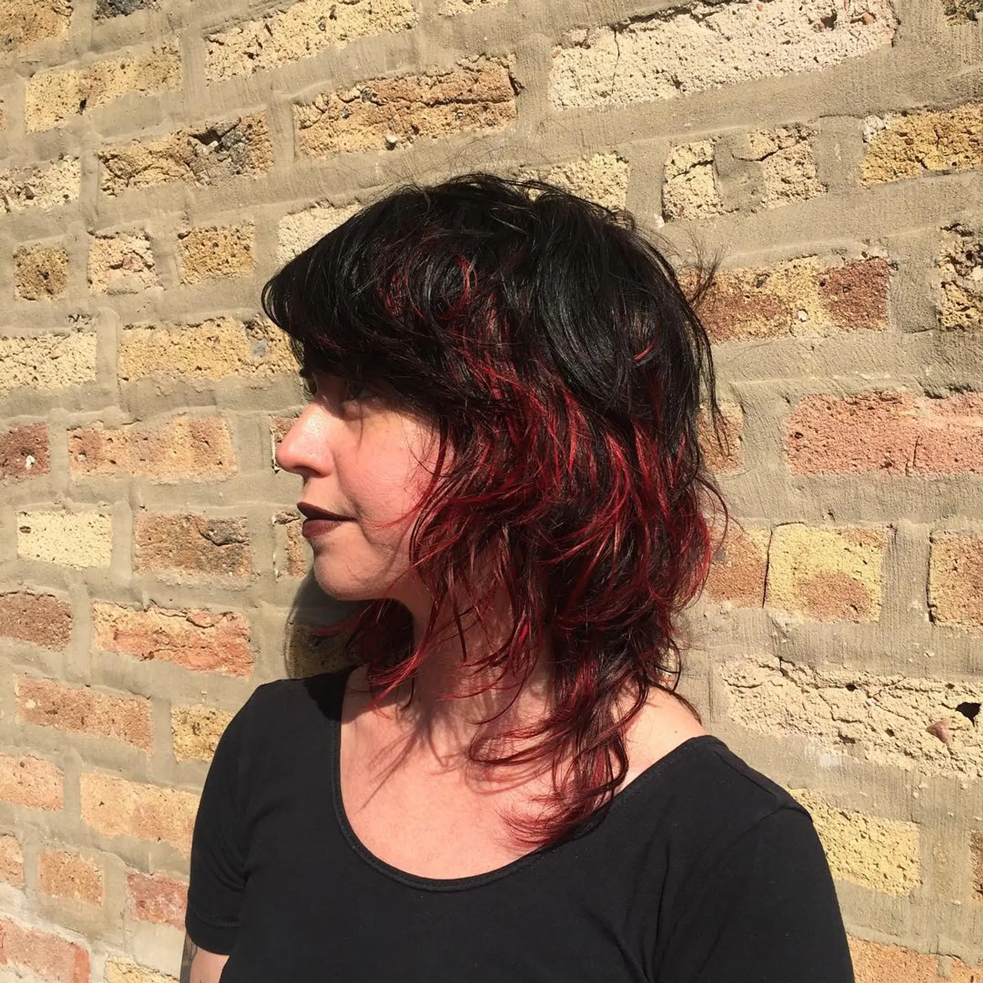 A textured medium shag with choppy layers and vibrant red highlights. 1