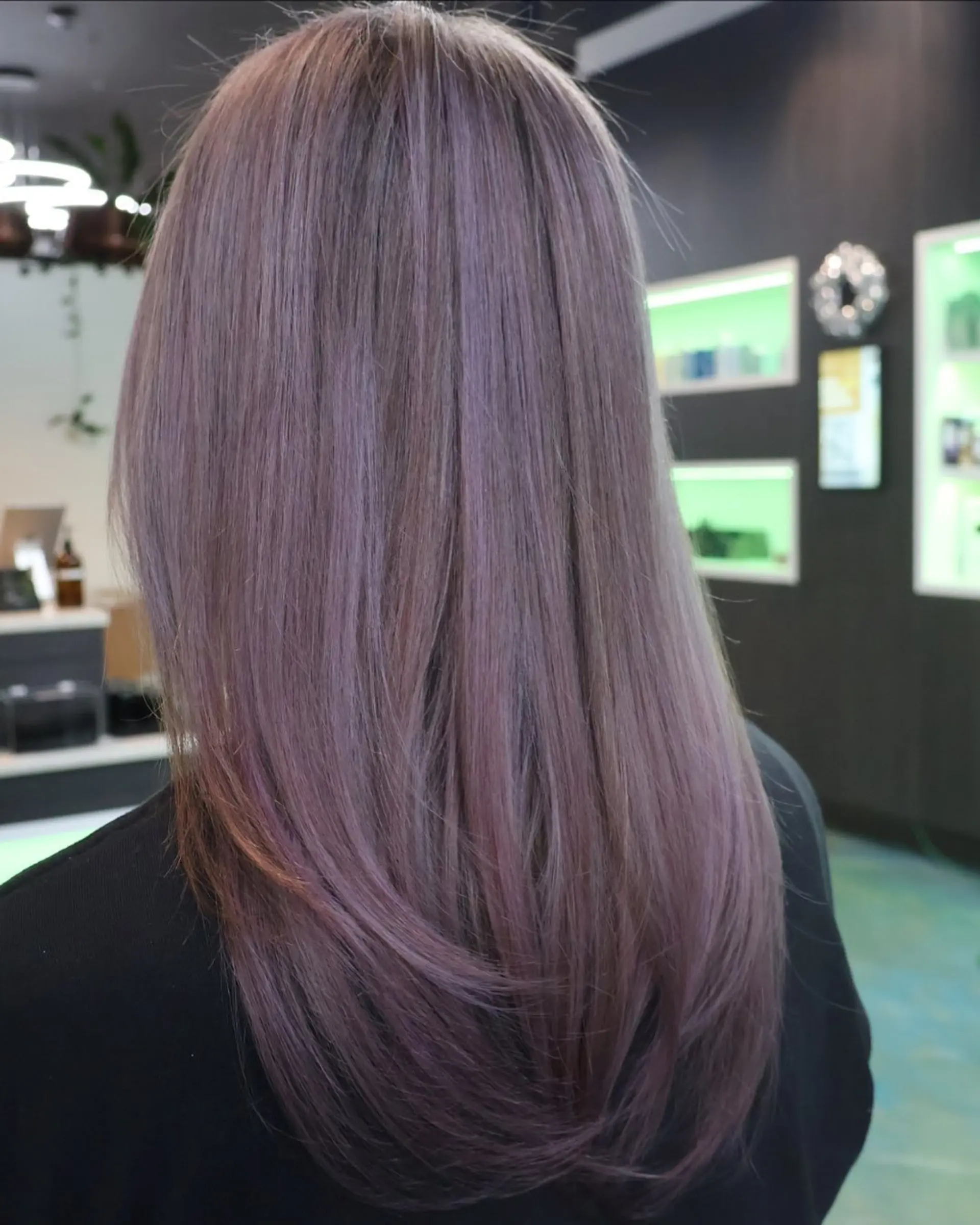 A layered hairstyle with a smoky lavender and silver color. 2