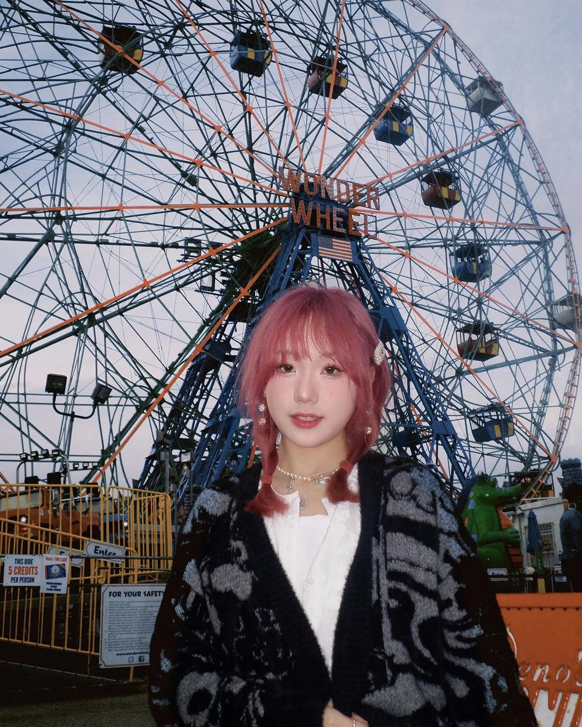 Medium-length, wavy pink hair with soft layers, fringed bangs, and two thin braids on either side, creating a playful and youthful look perfect for a teenager. 1