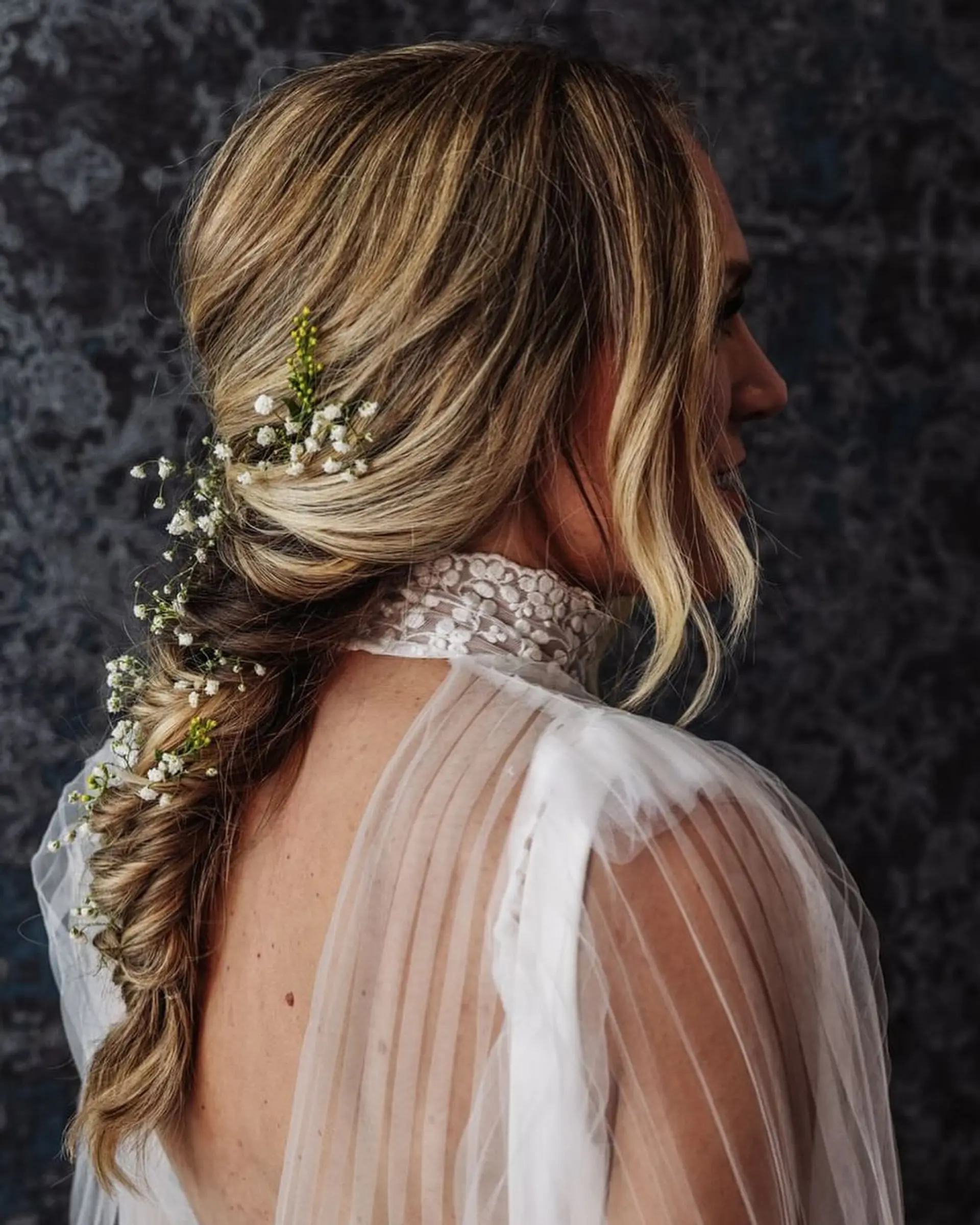 A romantic boho braid adorned with delicate floral accents. 1