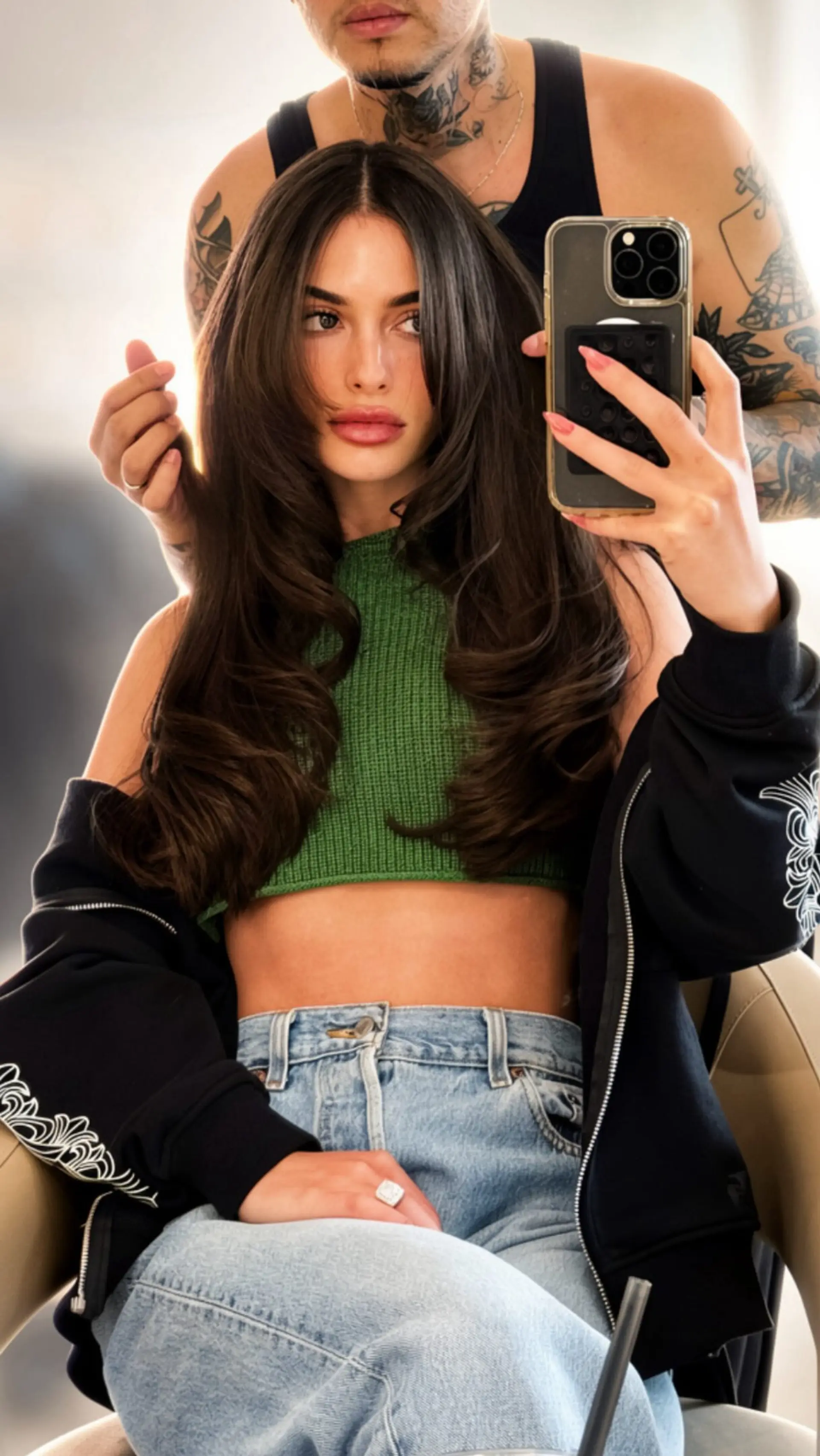 Voluminous 90s-style long haircut with face-framing curtain layers and curled, bouncy ends. 1
