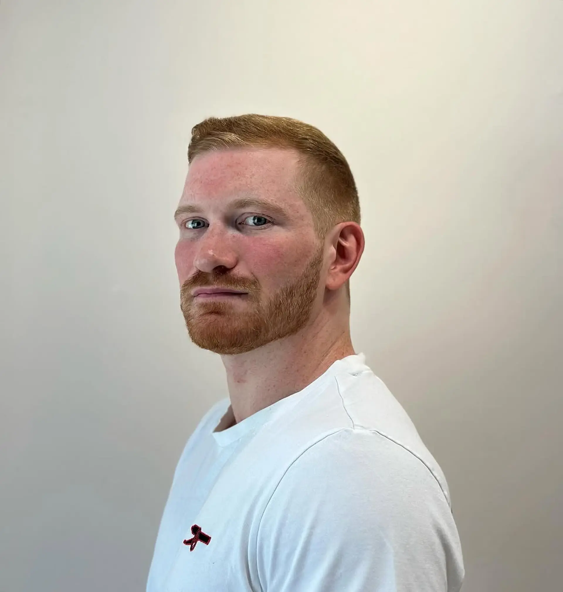 Short, sleek, and straight with a tapered fade and a subtle quiff on top, finished with a classic side part. 1