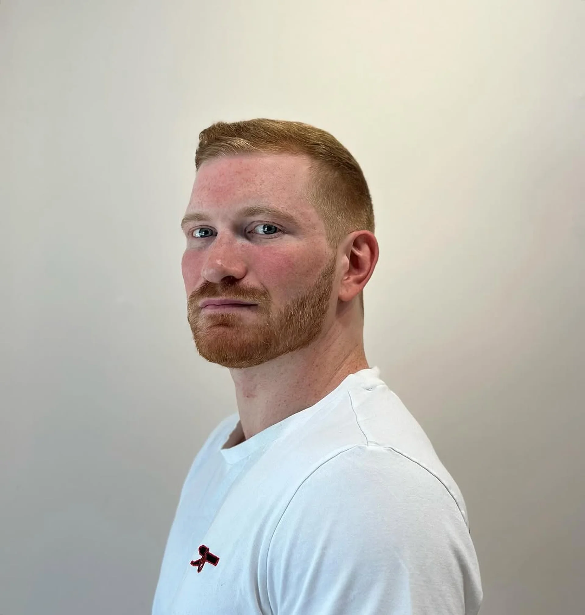 Sleek men's side-swept haircut with subtle side part and soft taper, styled with volume at the crown, perfect for the modern NYC gentleman. - Preview 3