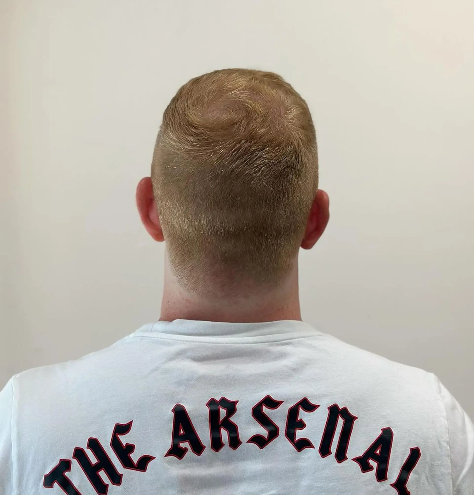 Short, sleek, and straight with a tapered fade and a subtle quiff on top, finished with a classic side part. 2