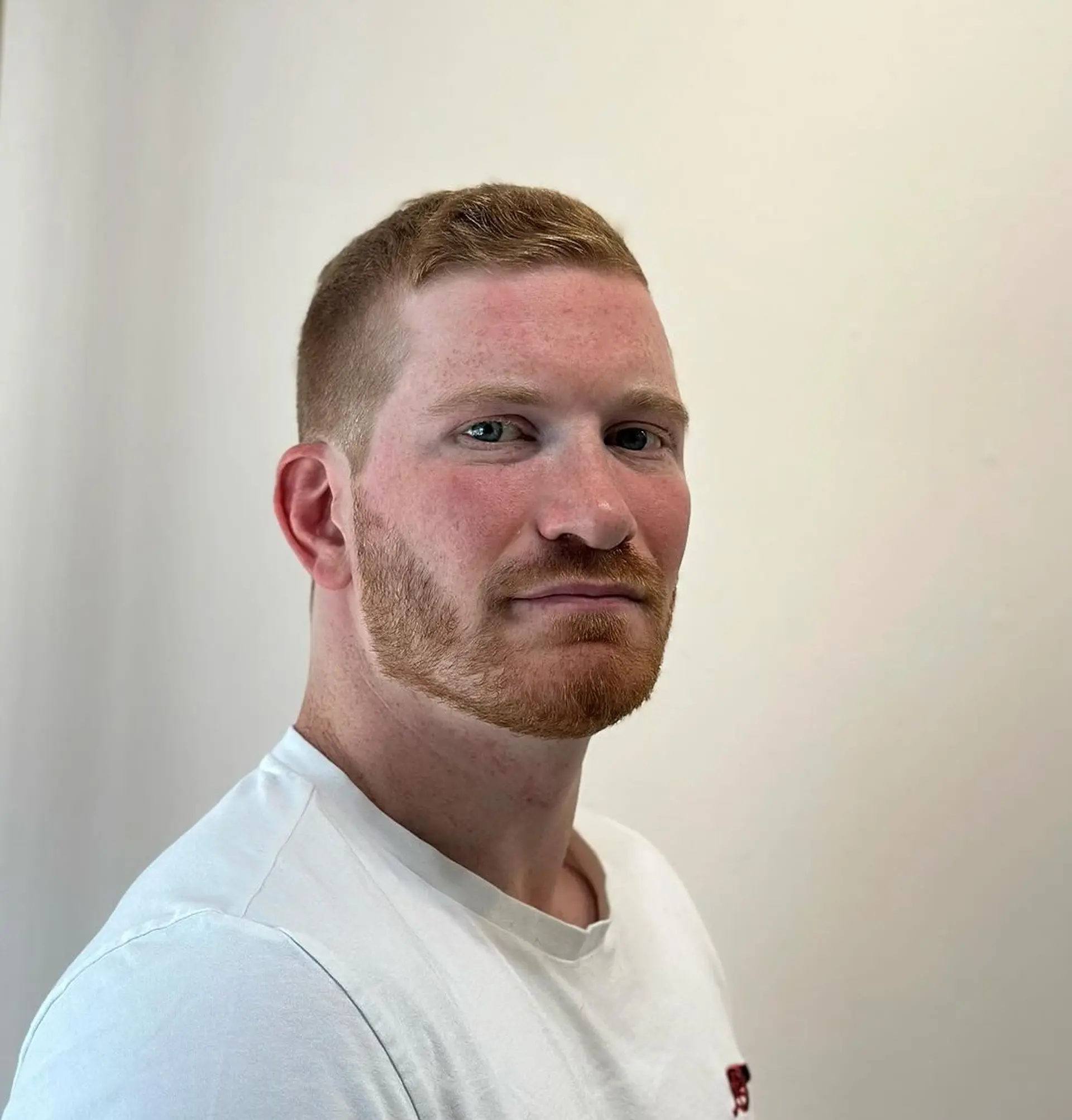 Short, sleek, and straight with a tapered fade and a subtle quiff on top, finished with a classic side part. 3