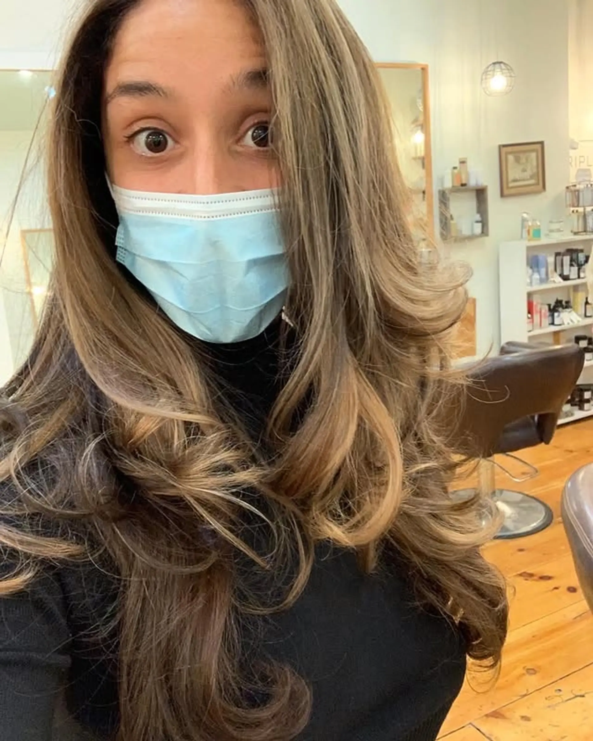 A long, layered haircut with a bronde balayage for a sun-kissed look. 1