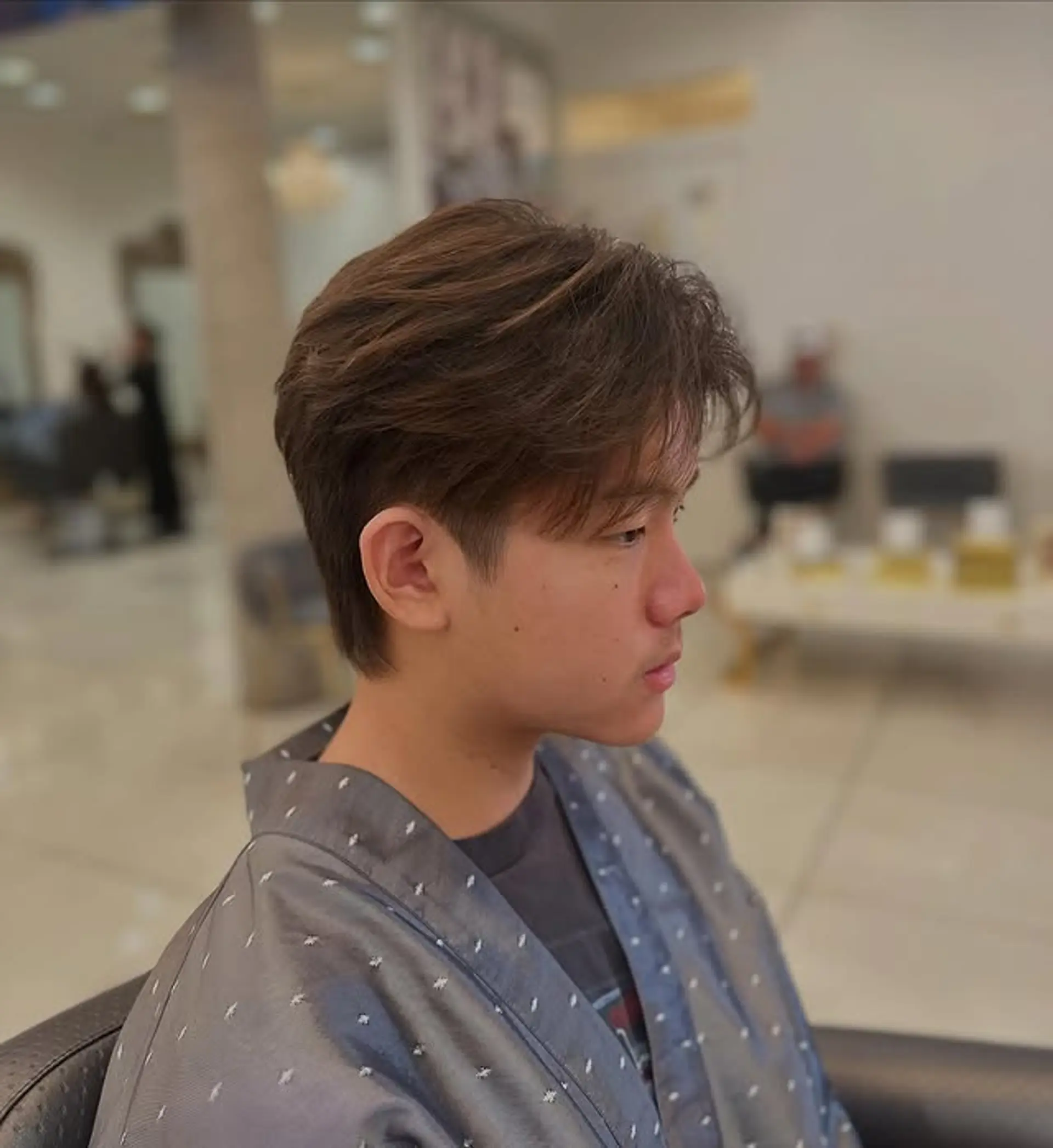 A contemporary take on the classic mullet, featuring soft, blended layers for a textured, effortless style. 1