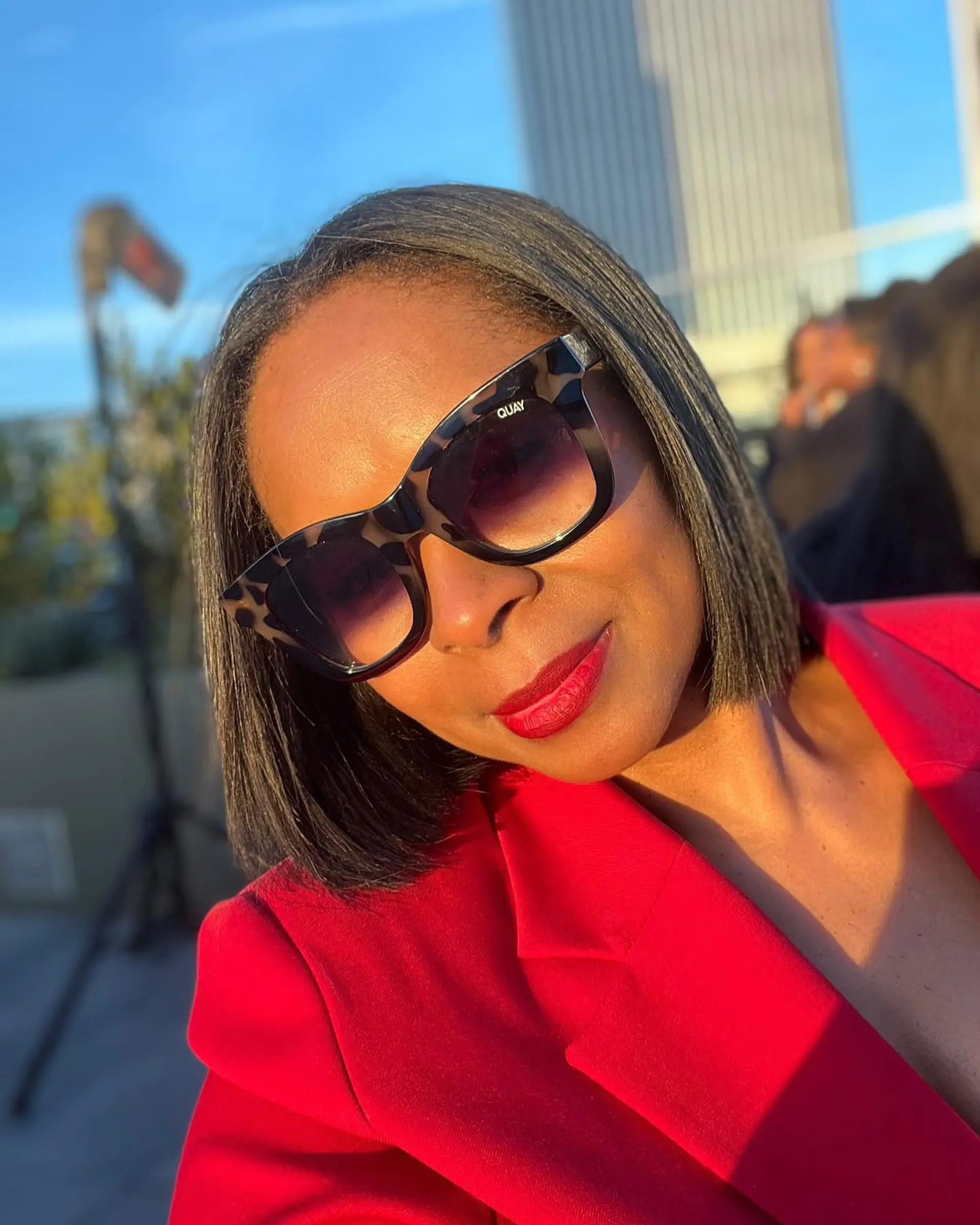 A sleek, chin-length blunt bob with clean, sharp edges and a glossy, straight finish. 1