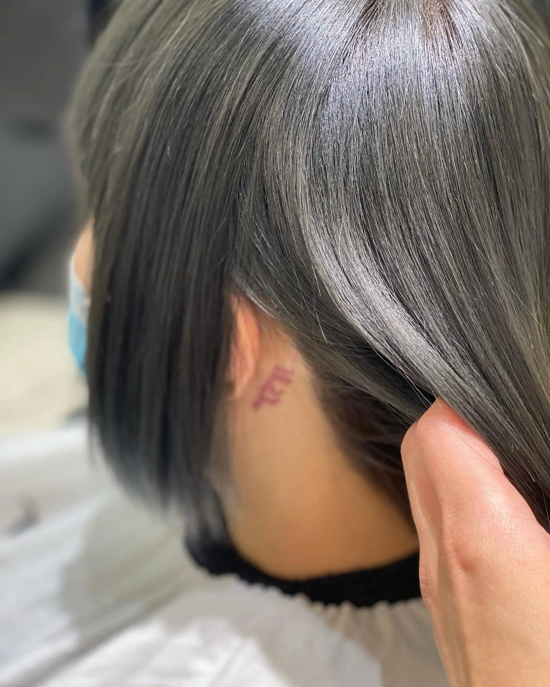 A medium length, sleek, straight blunt bob with a full, blunt fringe. 3