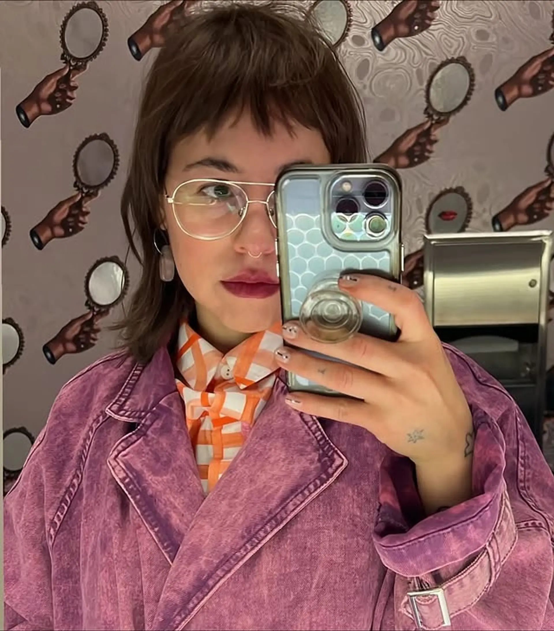 A modern take on the classic mullet, blended with shag elements featuring choppy layers and textured bangs. 1