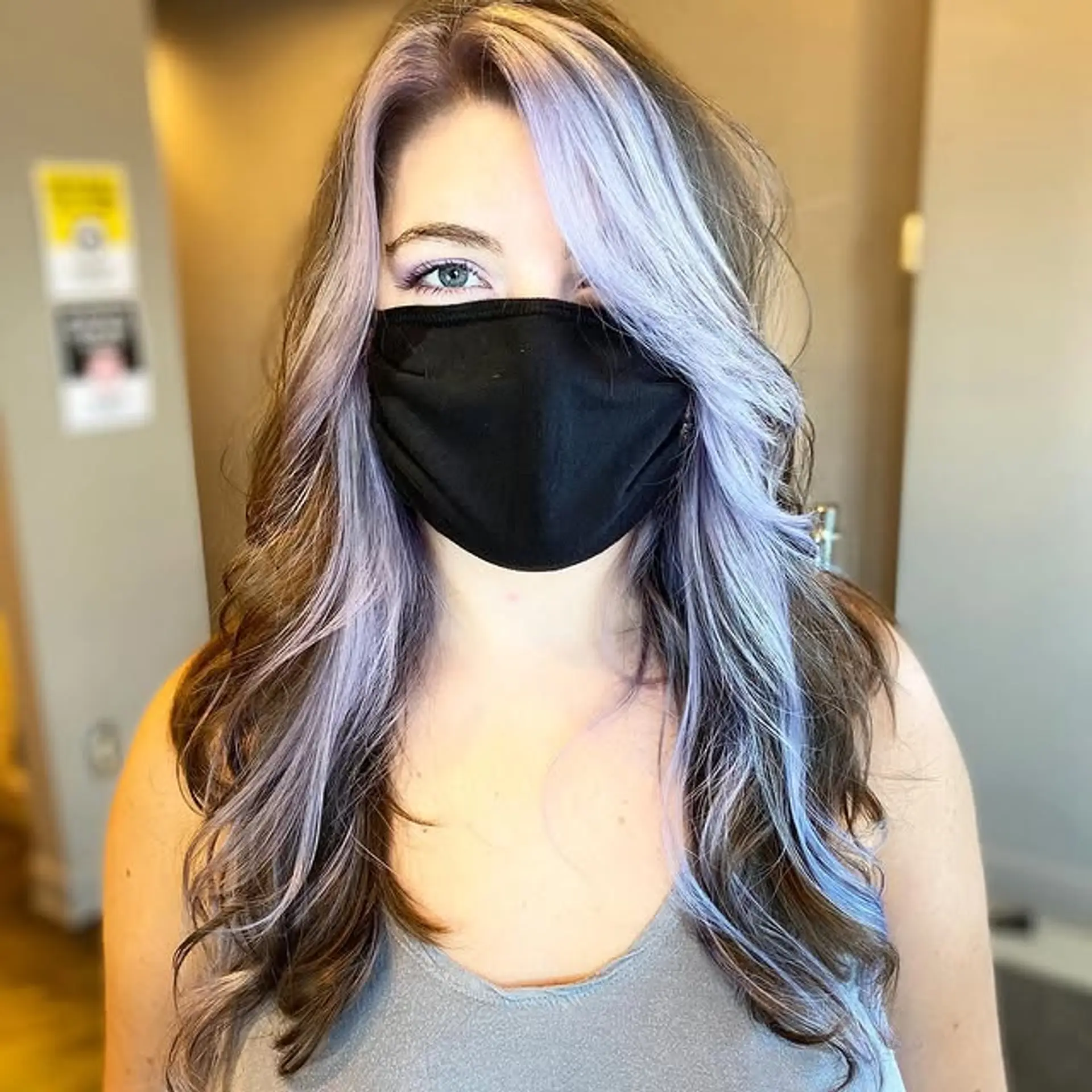 Long wavy hair with lilac highlights framing the face. 1