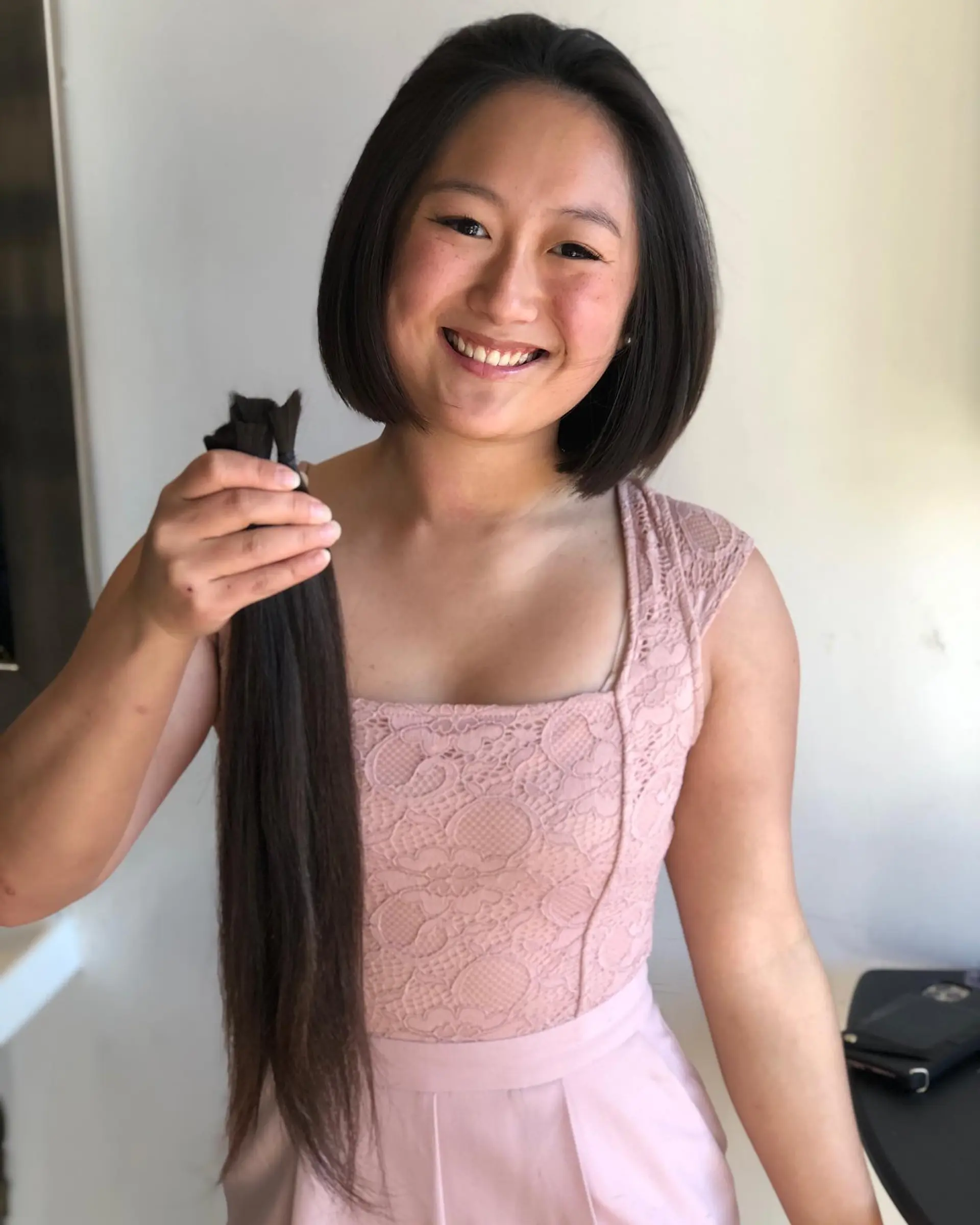 A sleek chin-length straight bob cut in a rich dark brown shade. 1
