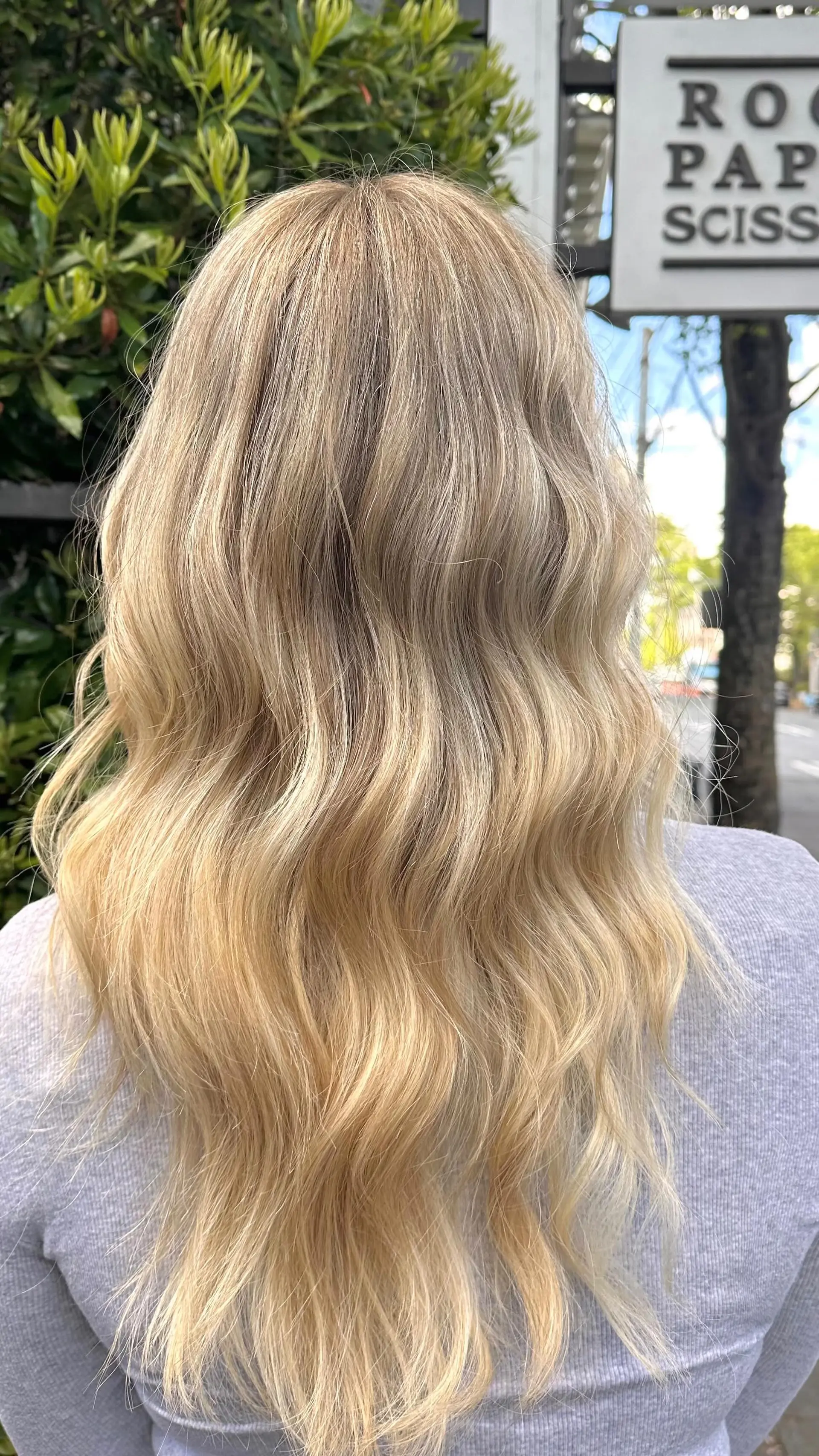 Long multi-dimensional blonde hair styled in soft, relaxed beach waves. 1