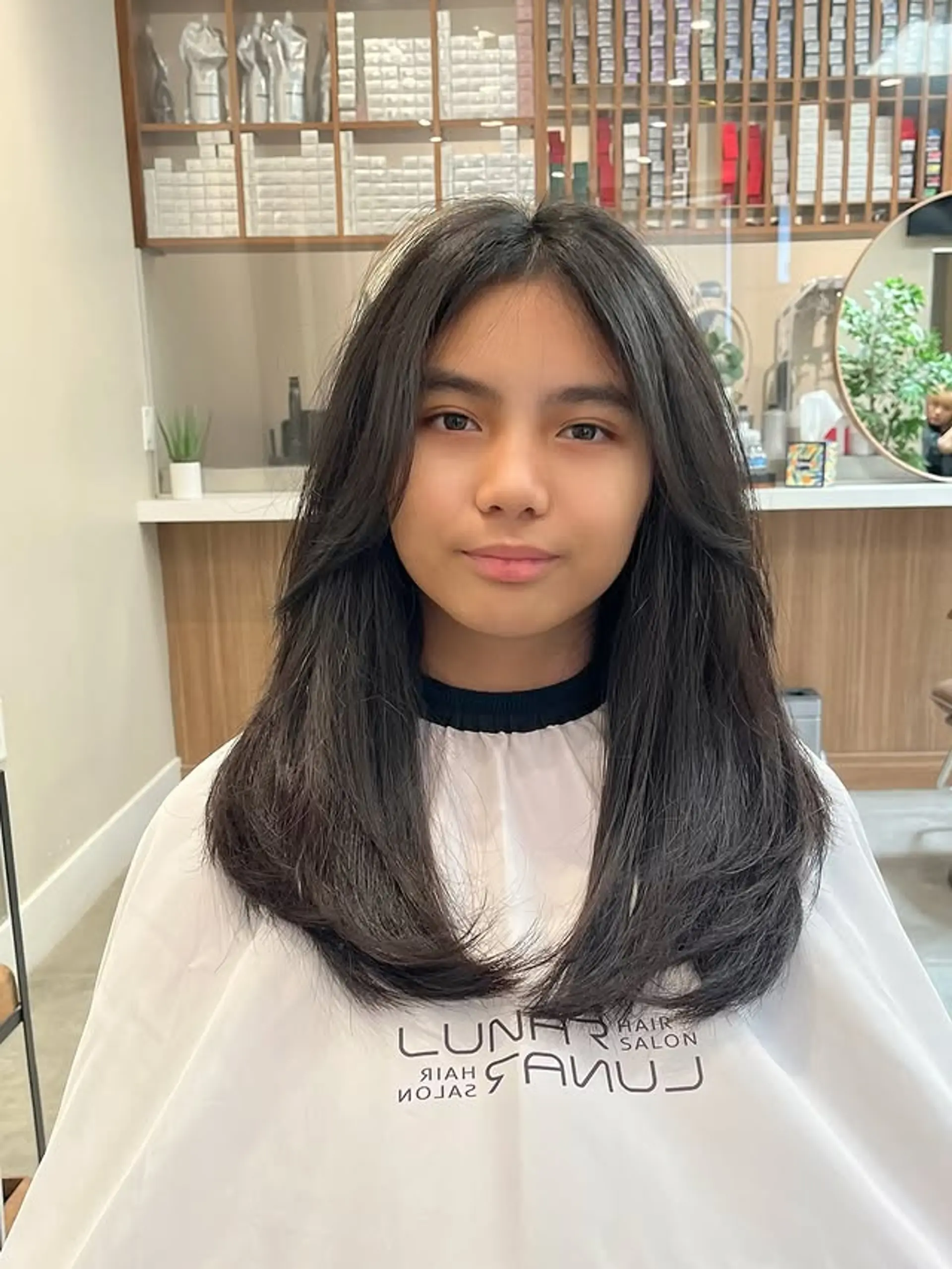 Long, straight hair with face-framing layers and curtain bangs. 1