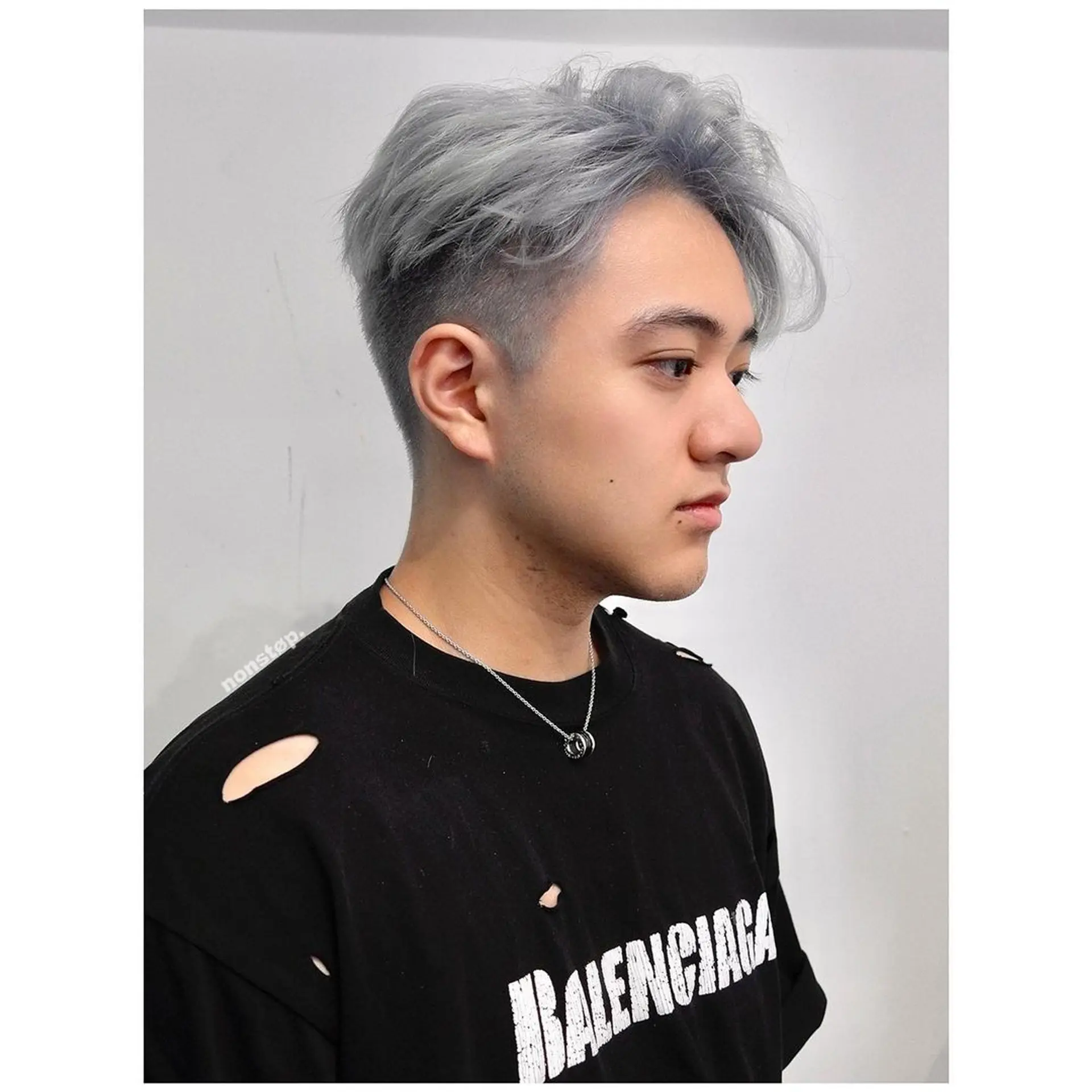 A short haircut with a clean fade on the sides and back, transitioning into a textured, wavy silver top styled with a side sweep. 🔗Hair by BEN🔗  1