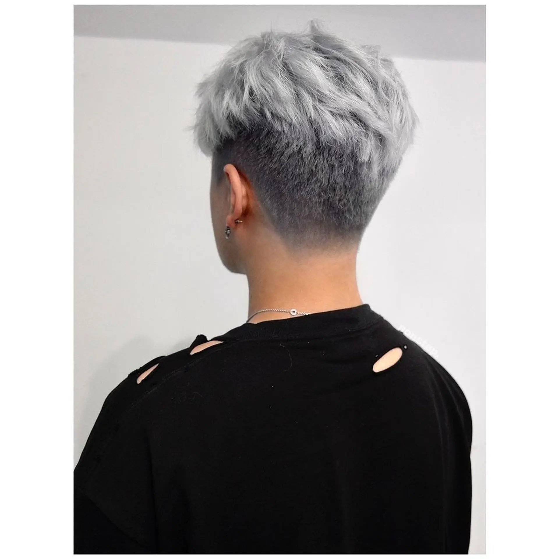 A short haircut with a clean fade on the sides and back, transitioning into a textured, wavy silver top styled with a side sweep. 🔗Hair by BEN🔗  2