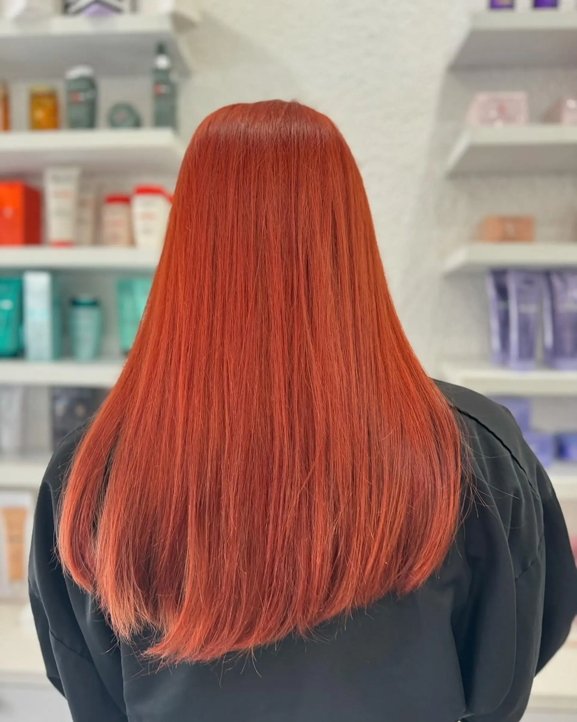Sleek, straight long hair with a vibrant red color, softly layered at the ends for slight movement and a polished, shiny look. 1