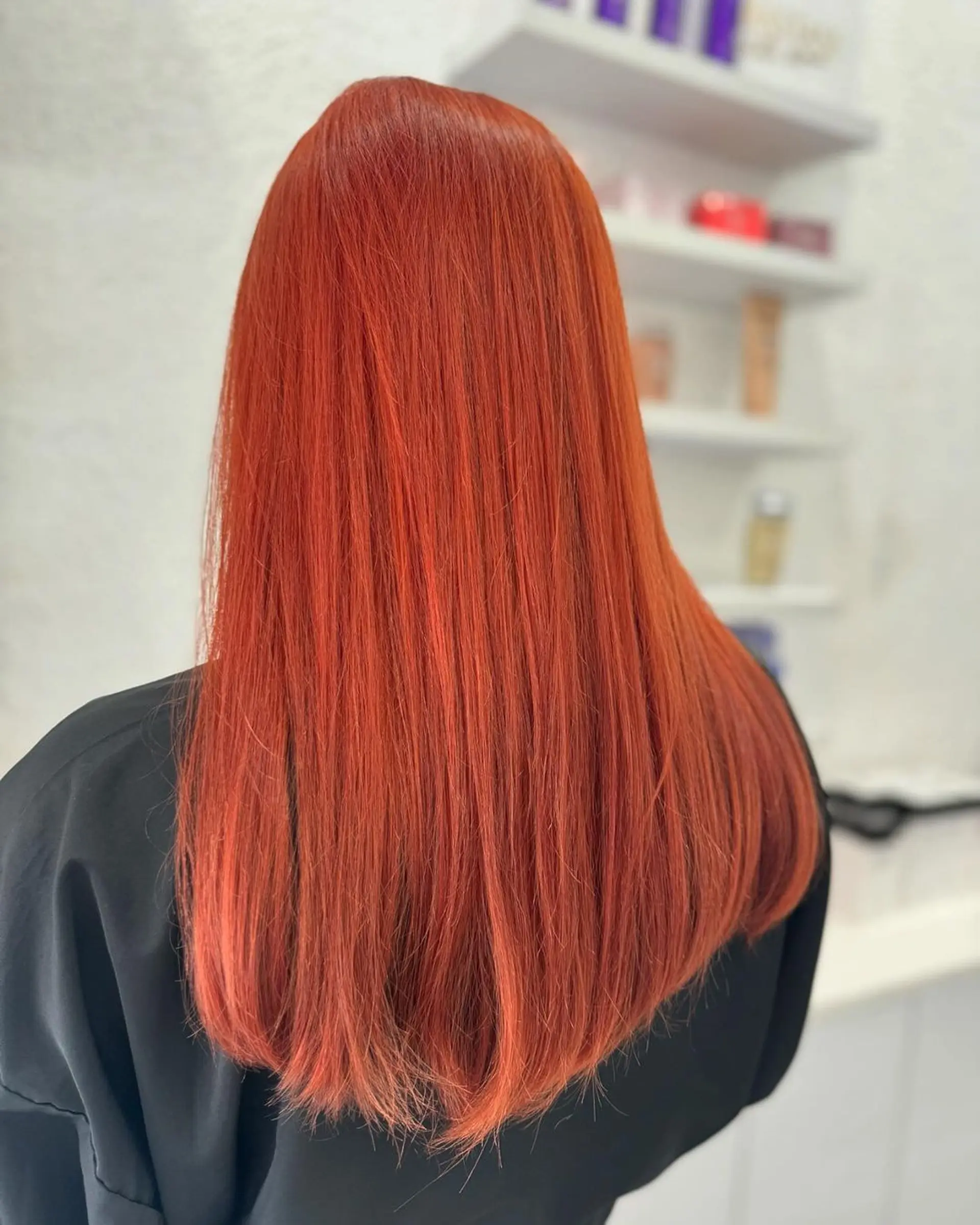 Sleek, straight long hair with a vibrant red color, softly layered at the ends for slight movement and a polished, shiny look. 2