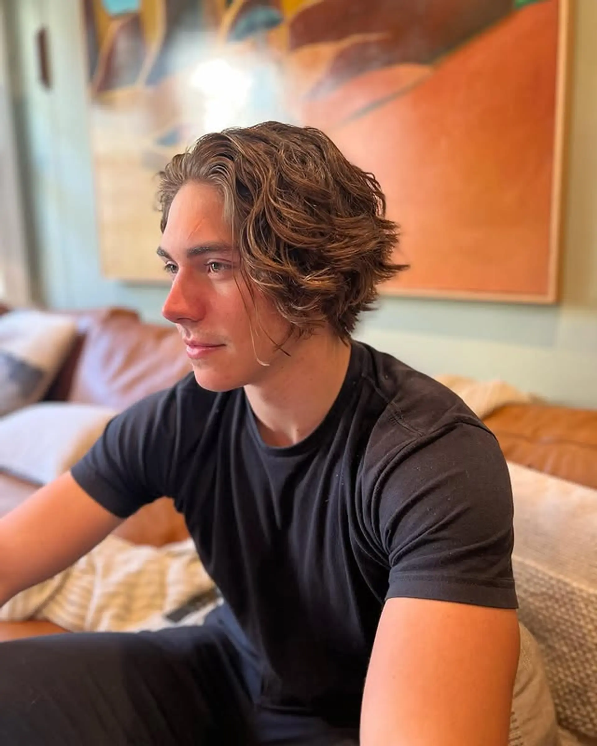 A medium-length wavy hairstyle with layers for added texture and volume. 1