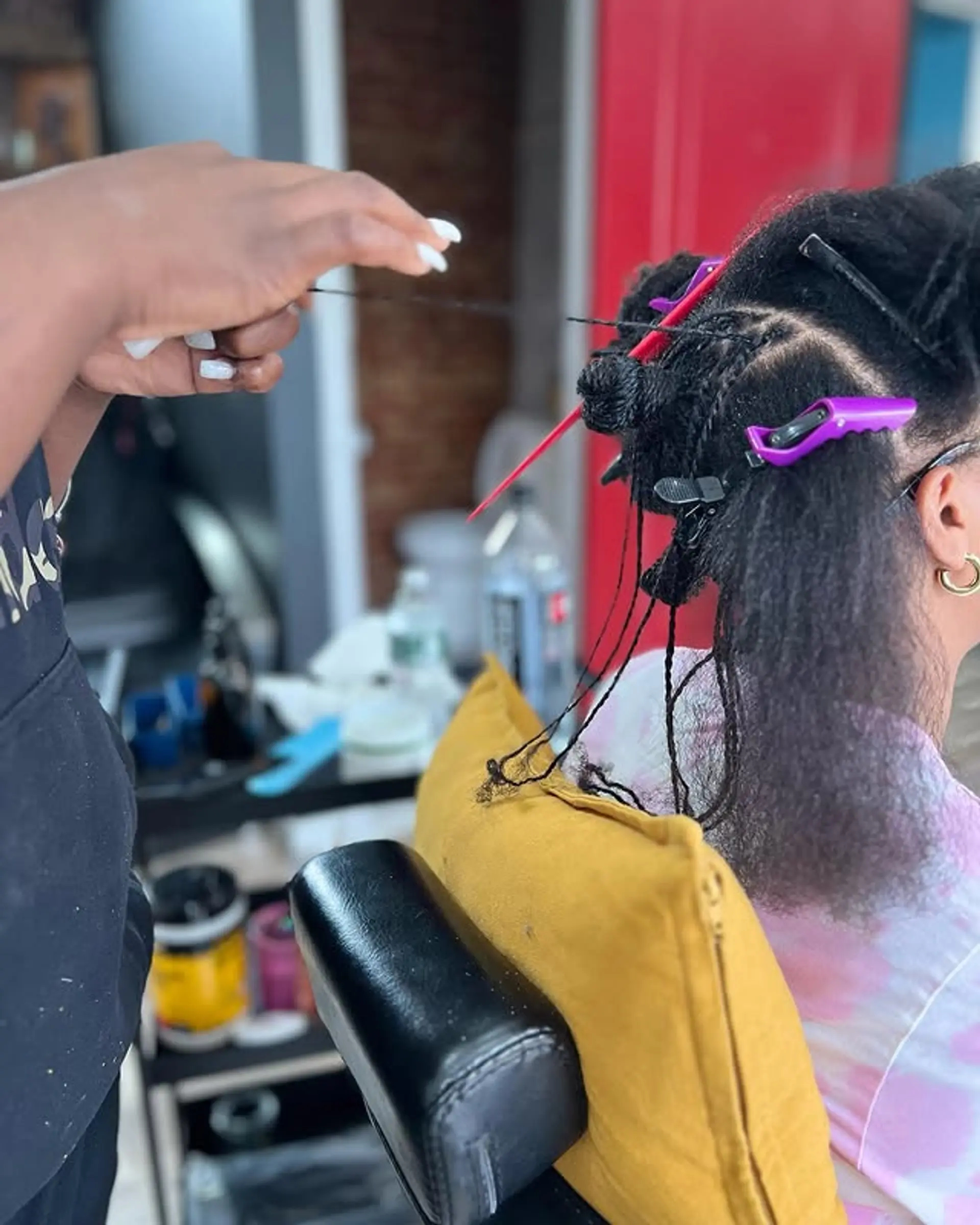 Sisterlocks are installed with afro kinky extensions to create a protective and stylish look. 1