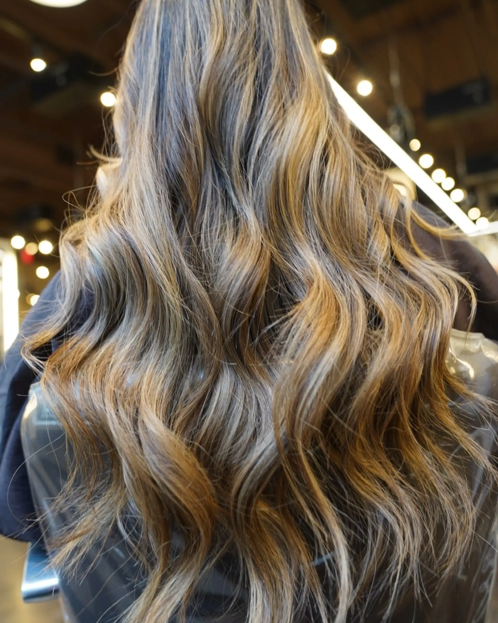 Long, wavy hair with a bronde balayage. 1