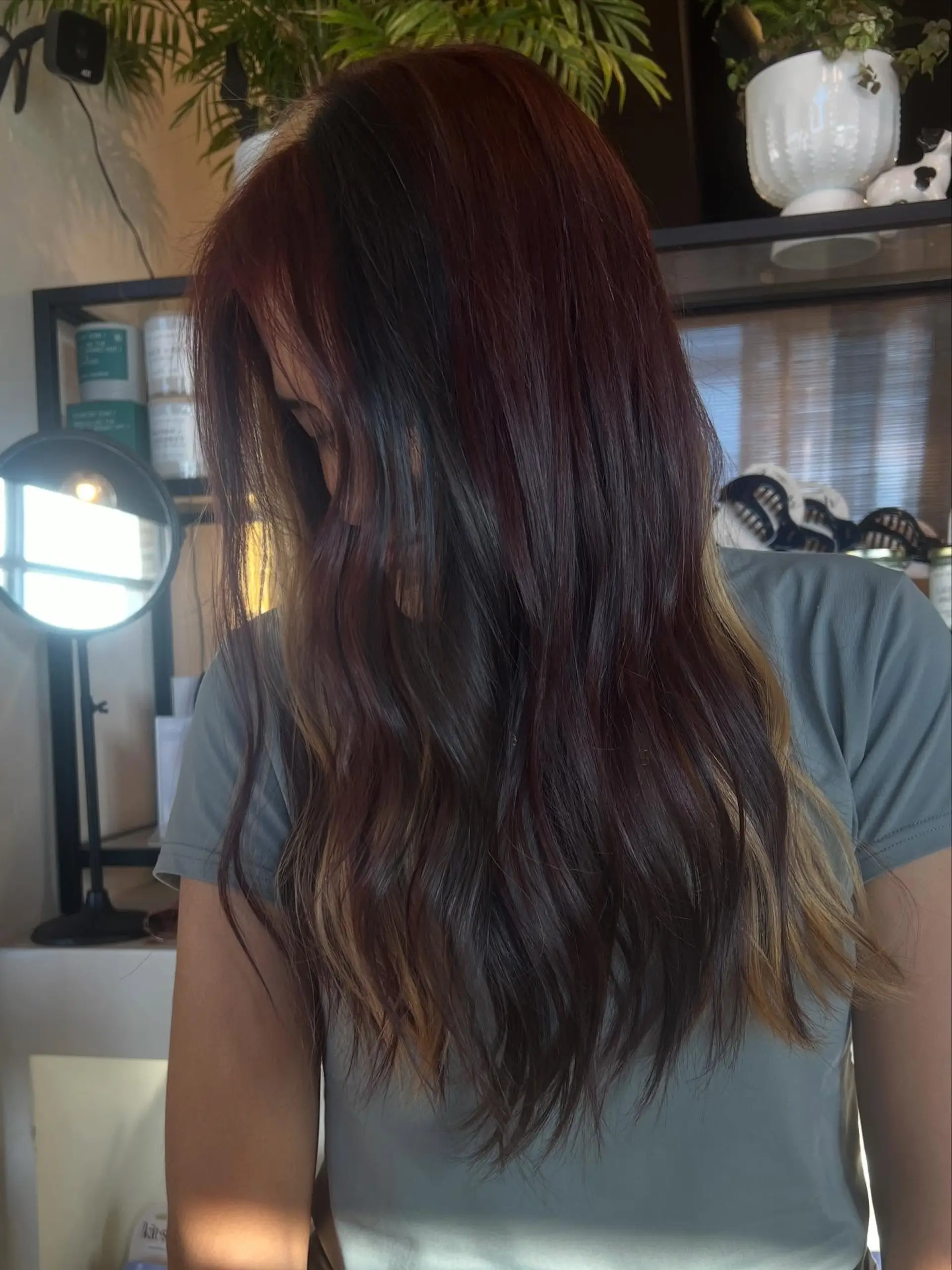 Long wavy hair styled with calico color blocking featuring contrasting tones of deep brunette, auburn red, and warm blonde. 1